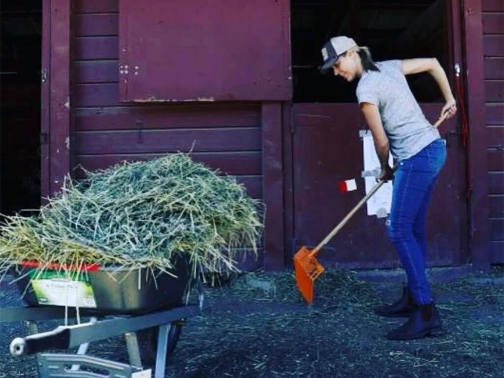 Aimee Kilmer outside with shovel volunteering at Sonoma County Animal Rescue
