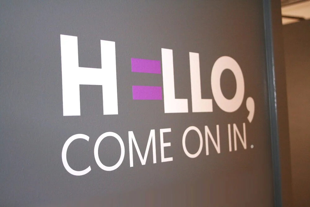 Global Fund for Women office branding wall sticker "Hello, come on in."