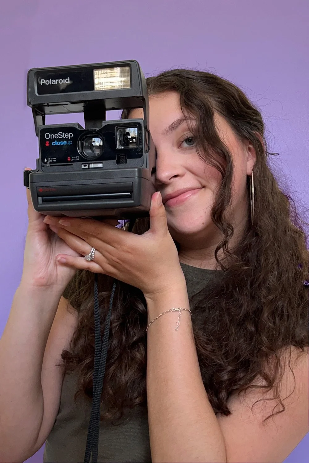 Sierra Danielle holding polaroid camera