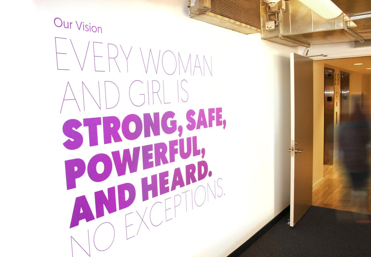 Global Fund for Women office branding "Our Vision" on wall