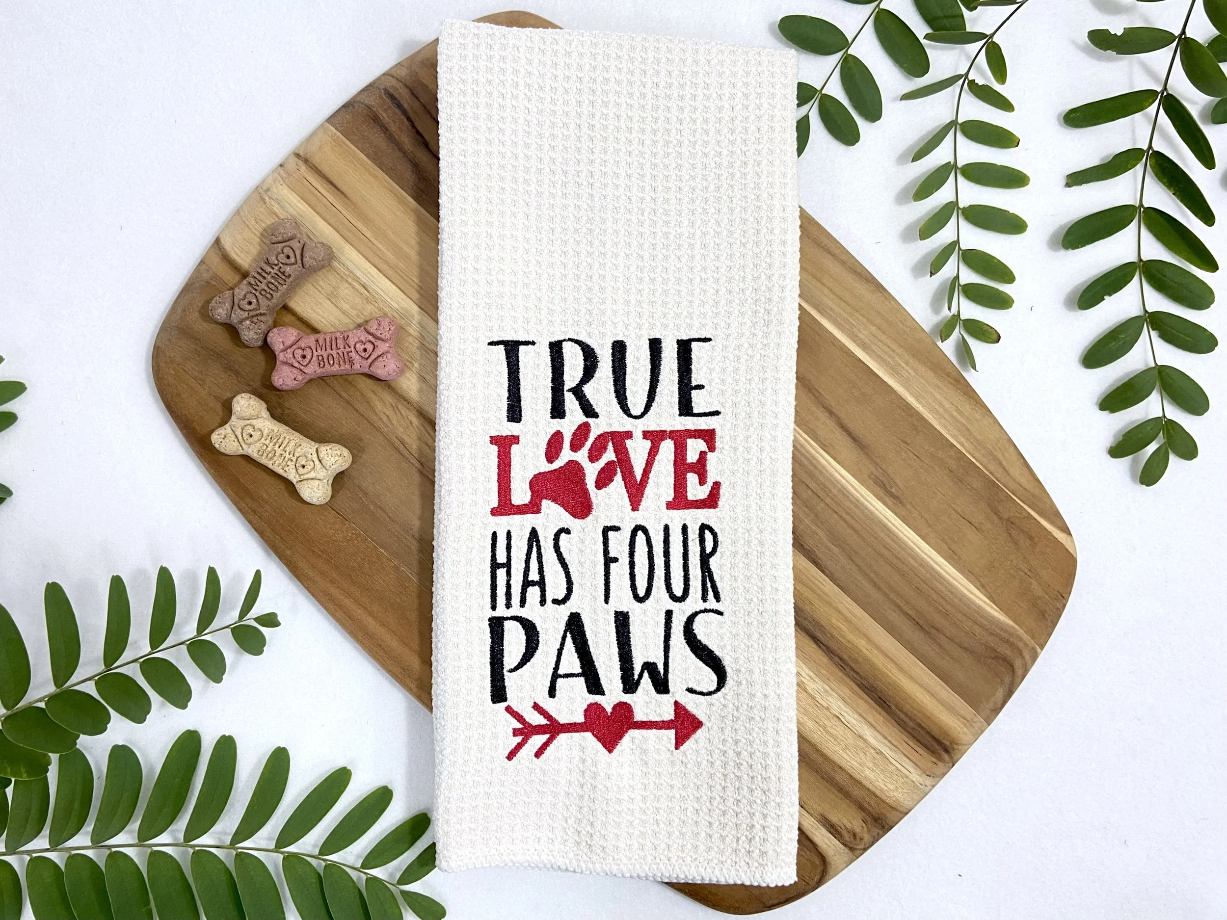 True Love Has Four Paws embroidered microfiber kitchen and hand towel flat lay with dog treats
