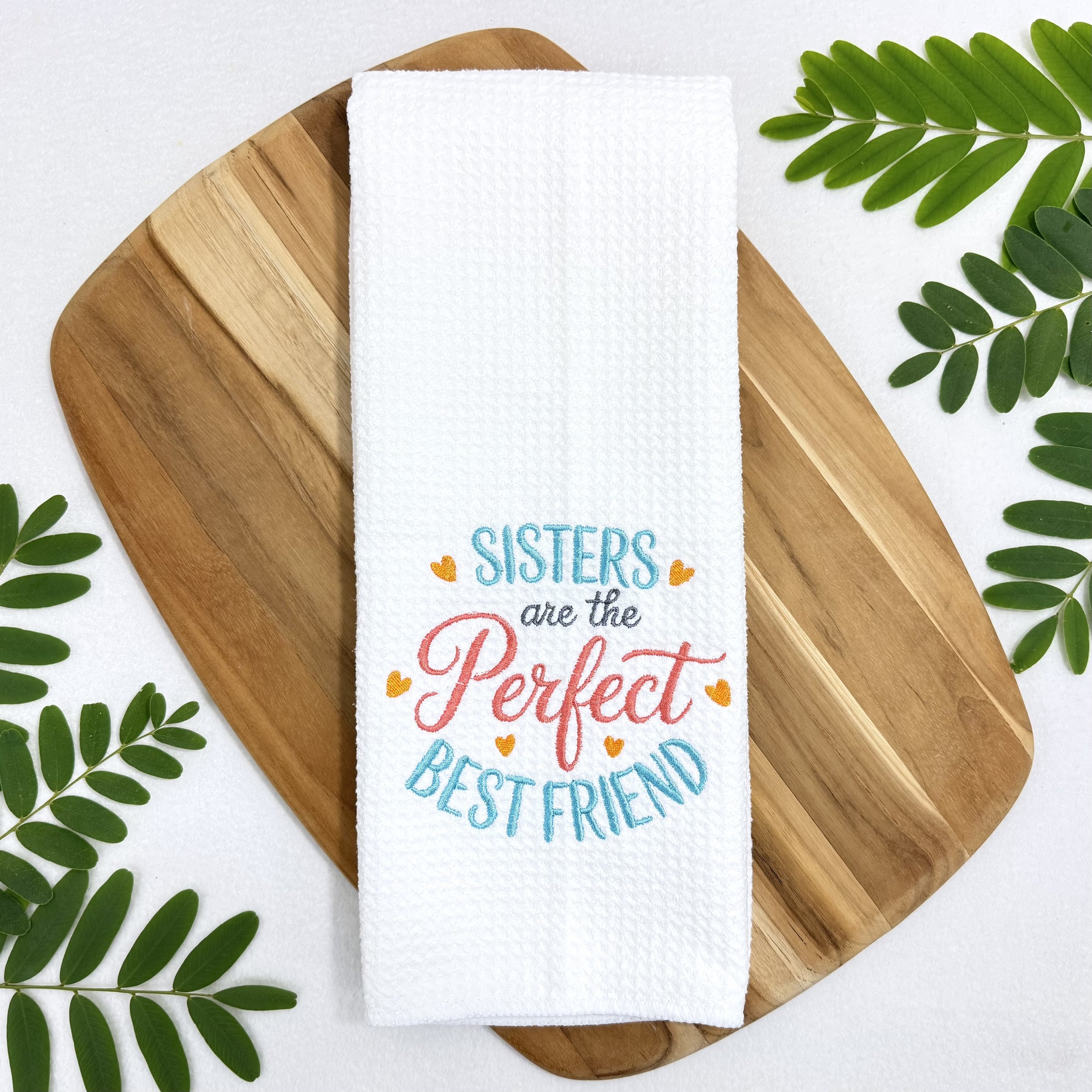 Sisters Are The Perfect Best Friend embroidered microfiber kitchen and hand towel flat lay with greenery