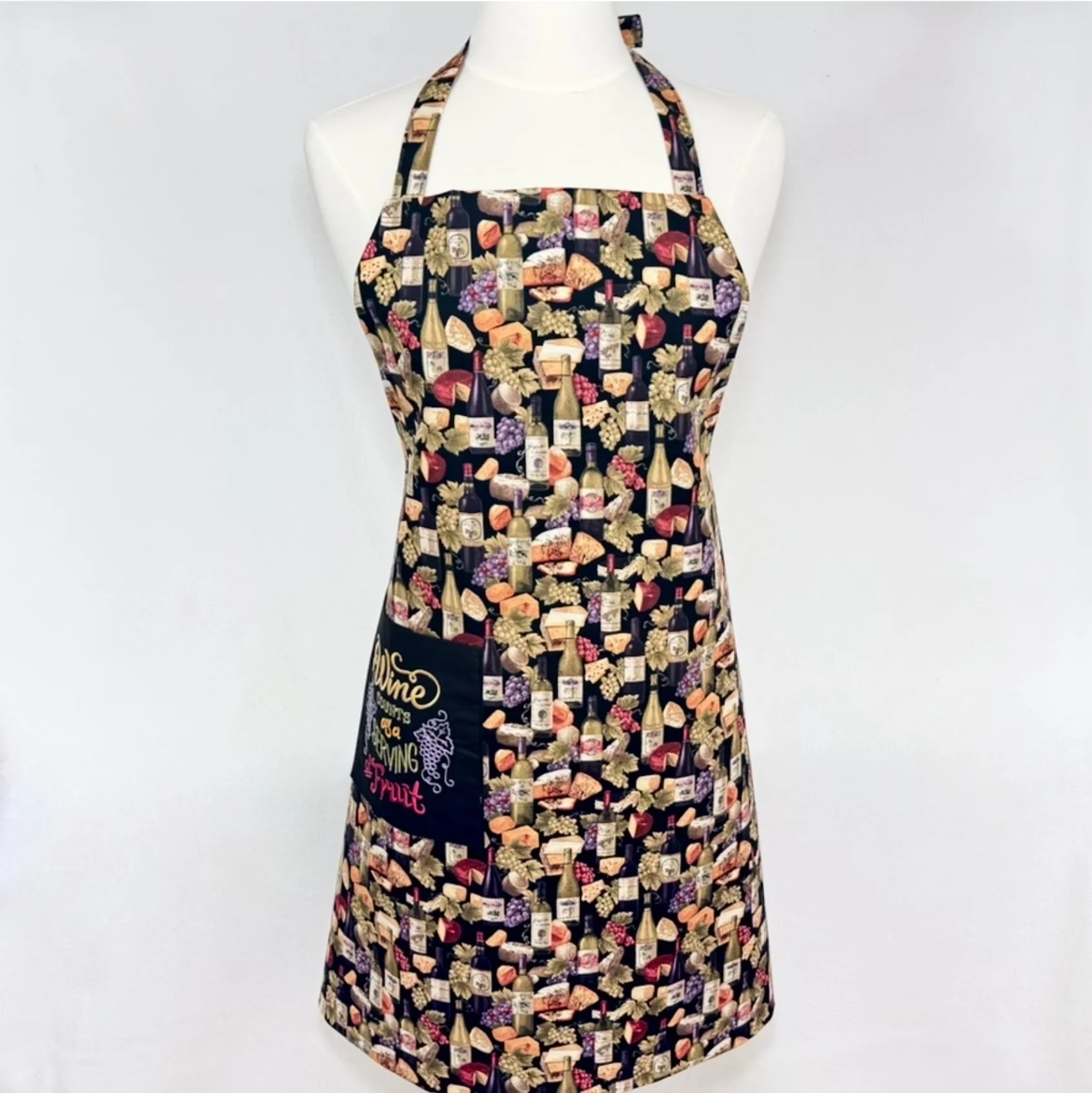 Wine counts as a serving of fruit adult apron displayed straight-on on mannequin
