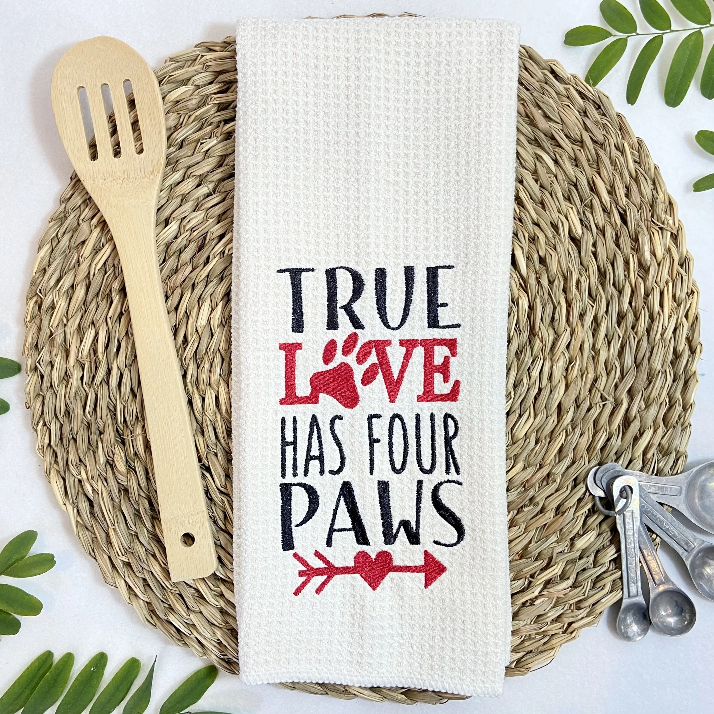 True Love Has Four Paws embroidered microfiber kitchen and hand towel flat lay with kitchen utensils