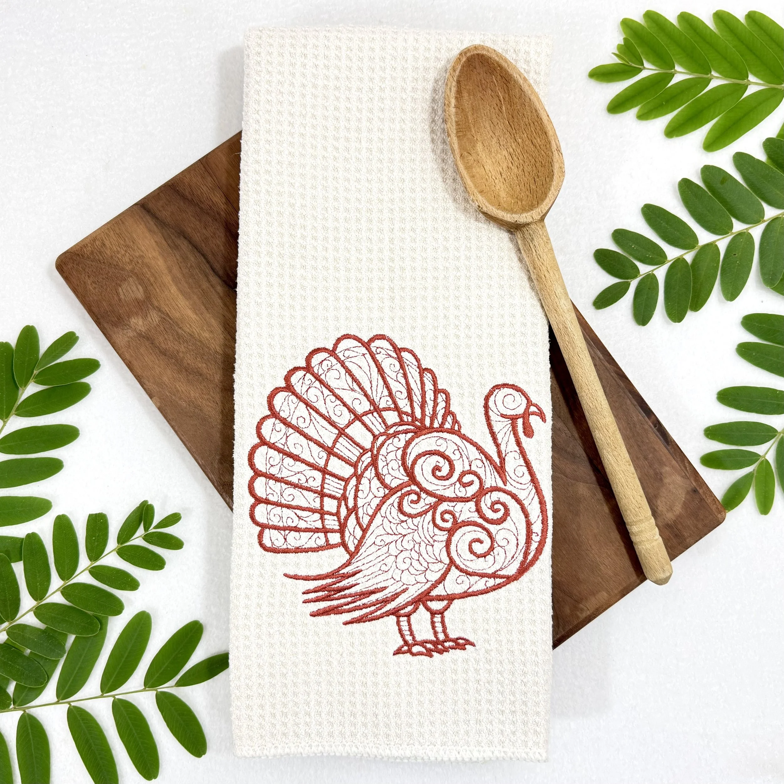Turkey embroidered microfiber kitchen and hand towel flat lay with greenery and kitchen tool