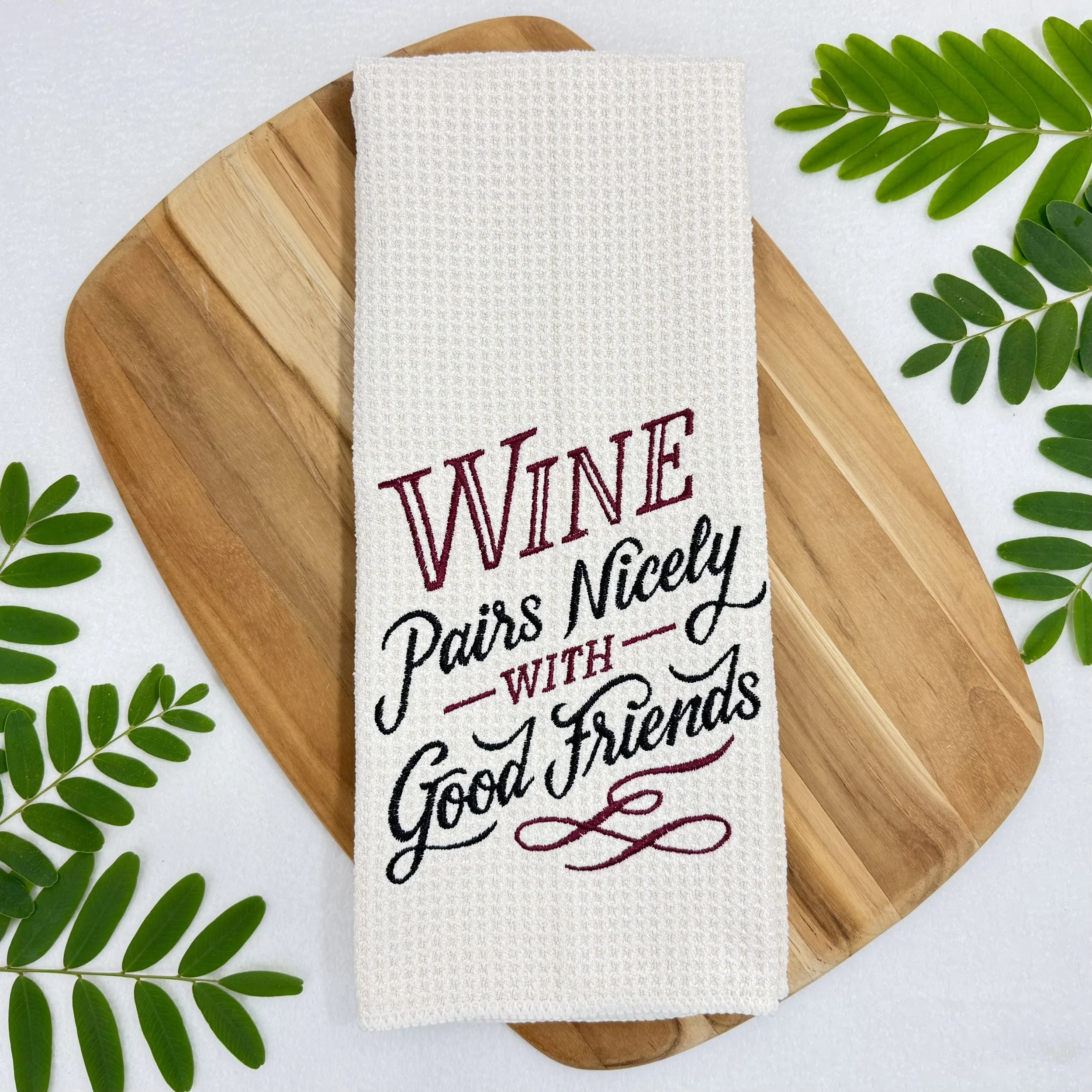 Wine Pairs Nicely with good friends embroidered microfiber kitchen and hand towel flat lay with greenery