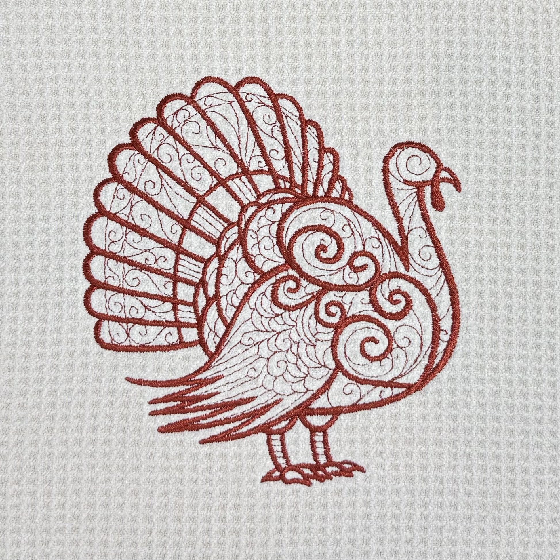 Close-up of Turkey embroidery on microfiber kitchen and hand towel, showing detailed stitching and towel texture