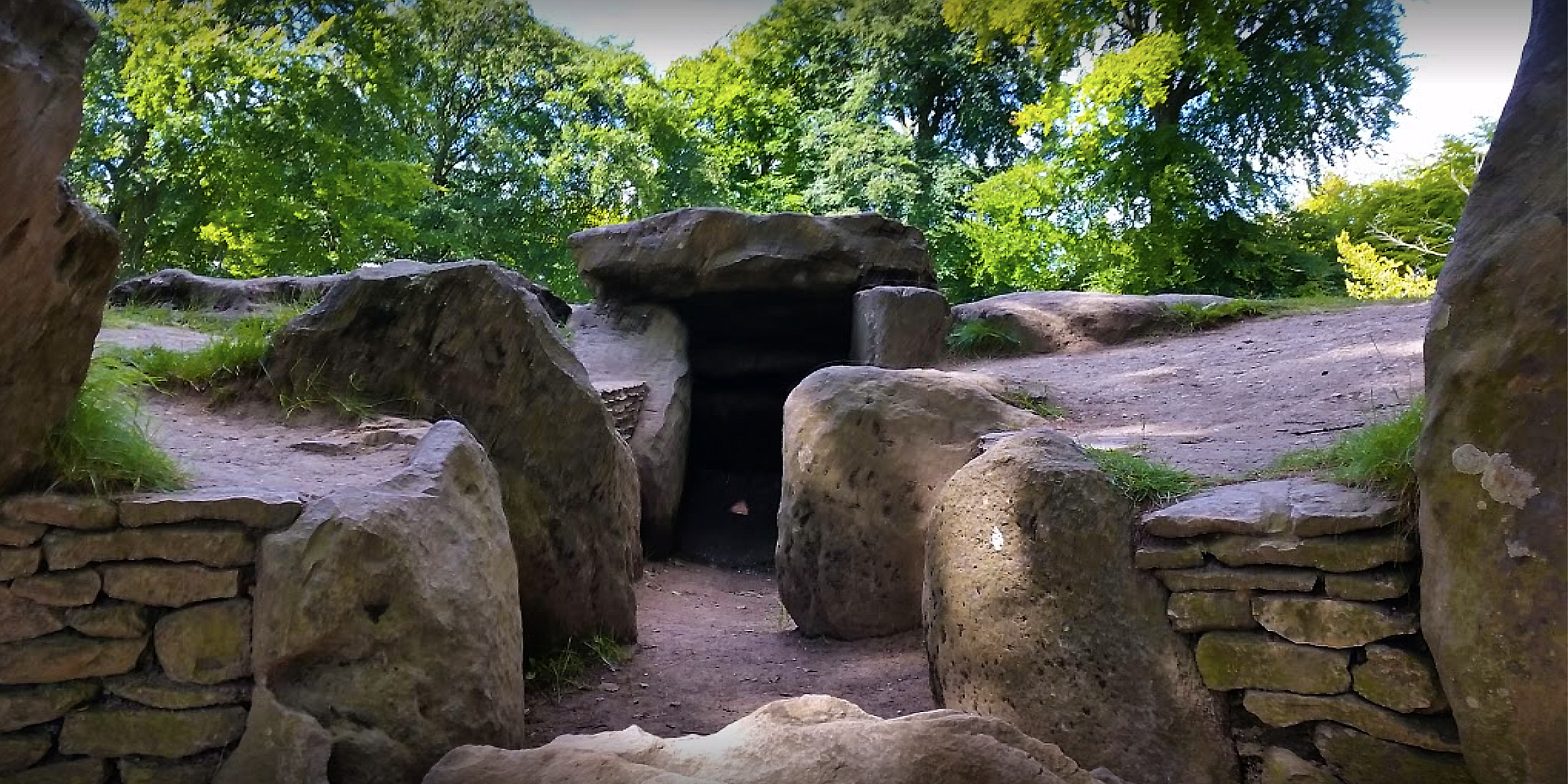  WAYLAN'S SMITHY  is a Neolithic burial and initiation site in Wiltshire, England. It includes a passage grave surrounded by a sacred grove of trees.