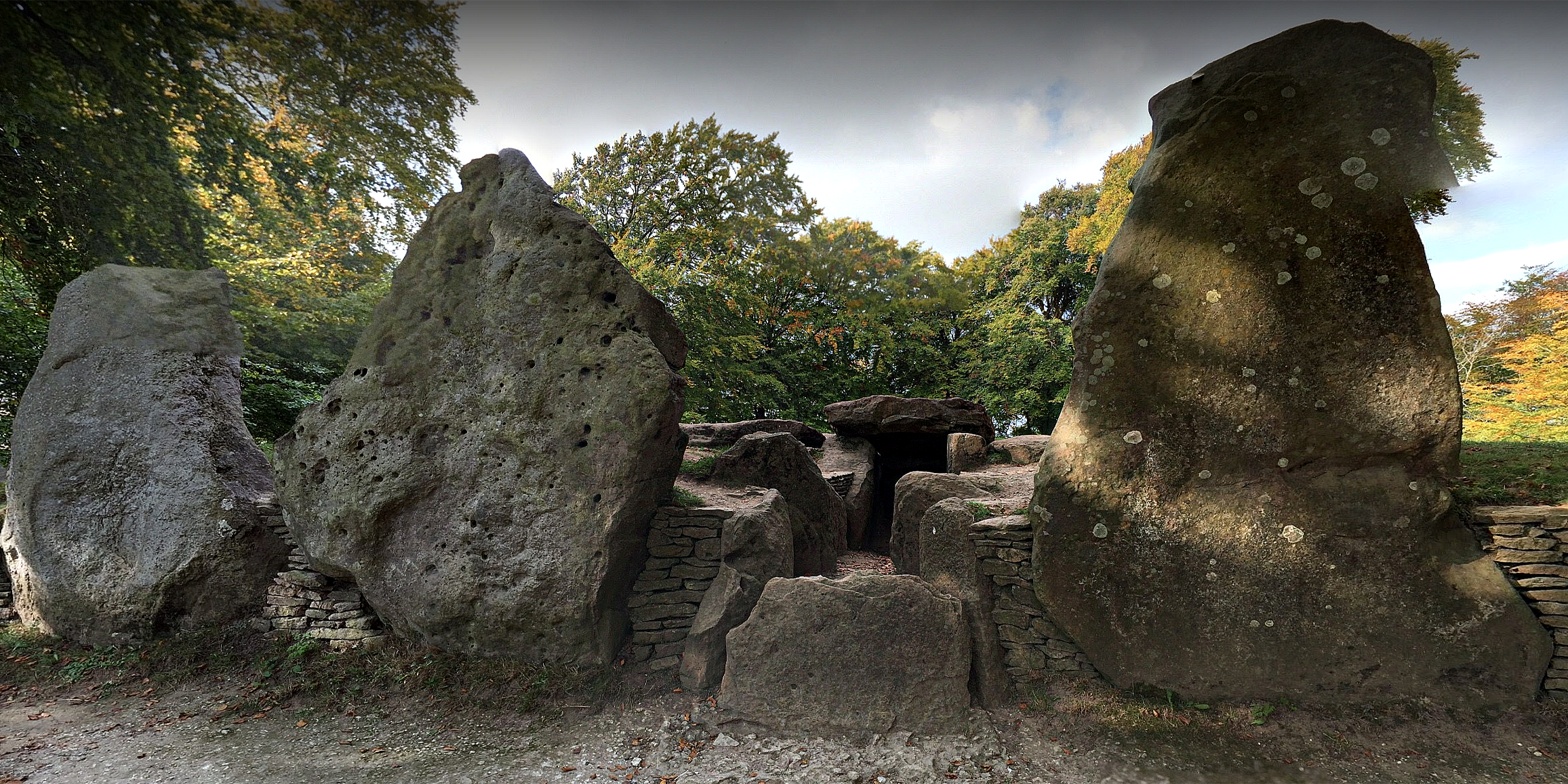  WAYLAN'S SMITHY  is a Neolithic burial and initiation site in Wiltshire, England. It includes a passage grave surrounded by a sacred grove of trees.
