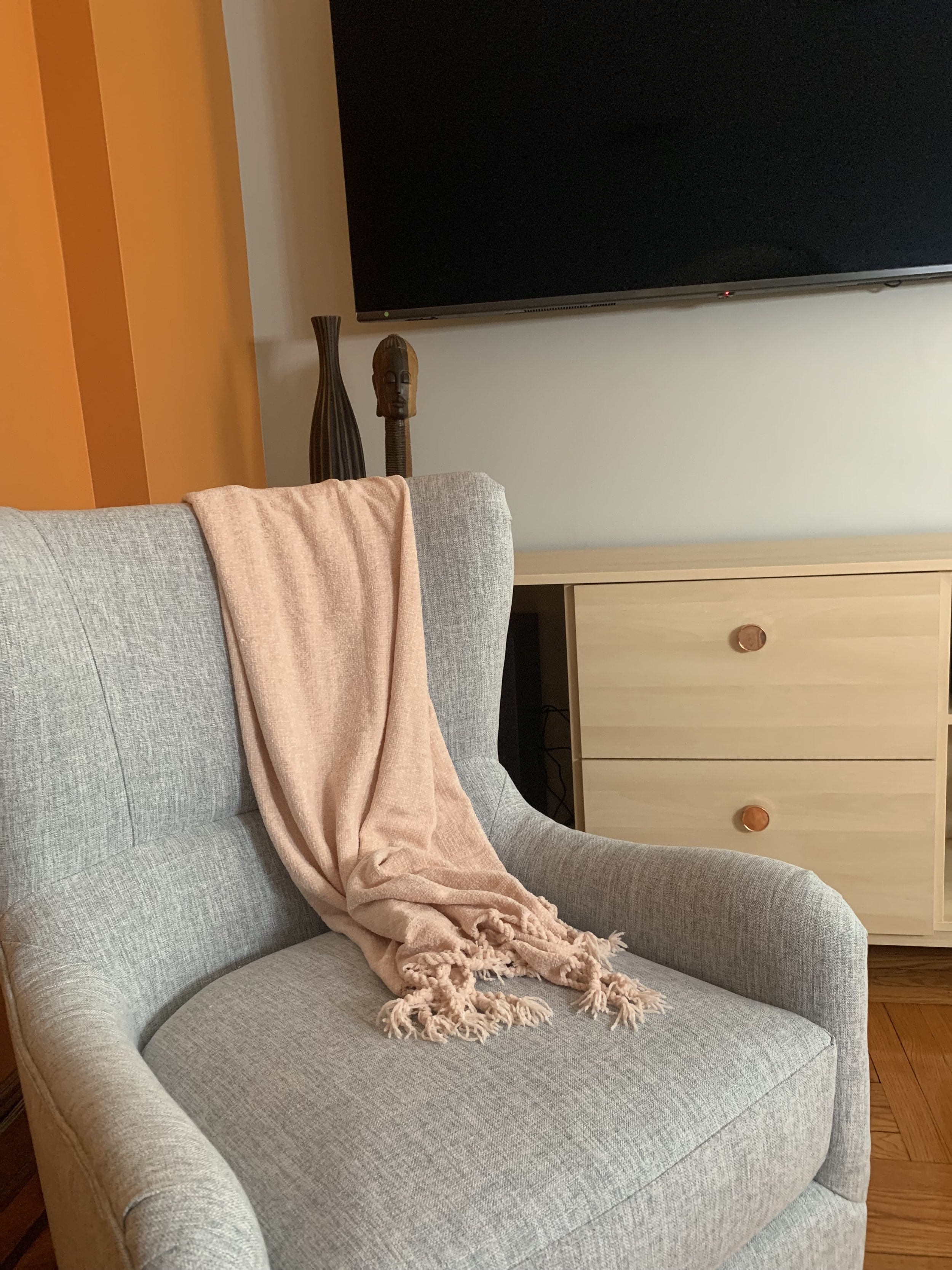 arm chair, Caribbean-inspired steel pan knobs and African themes, interior design by le terra curators