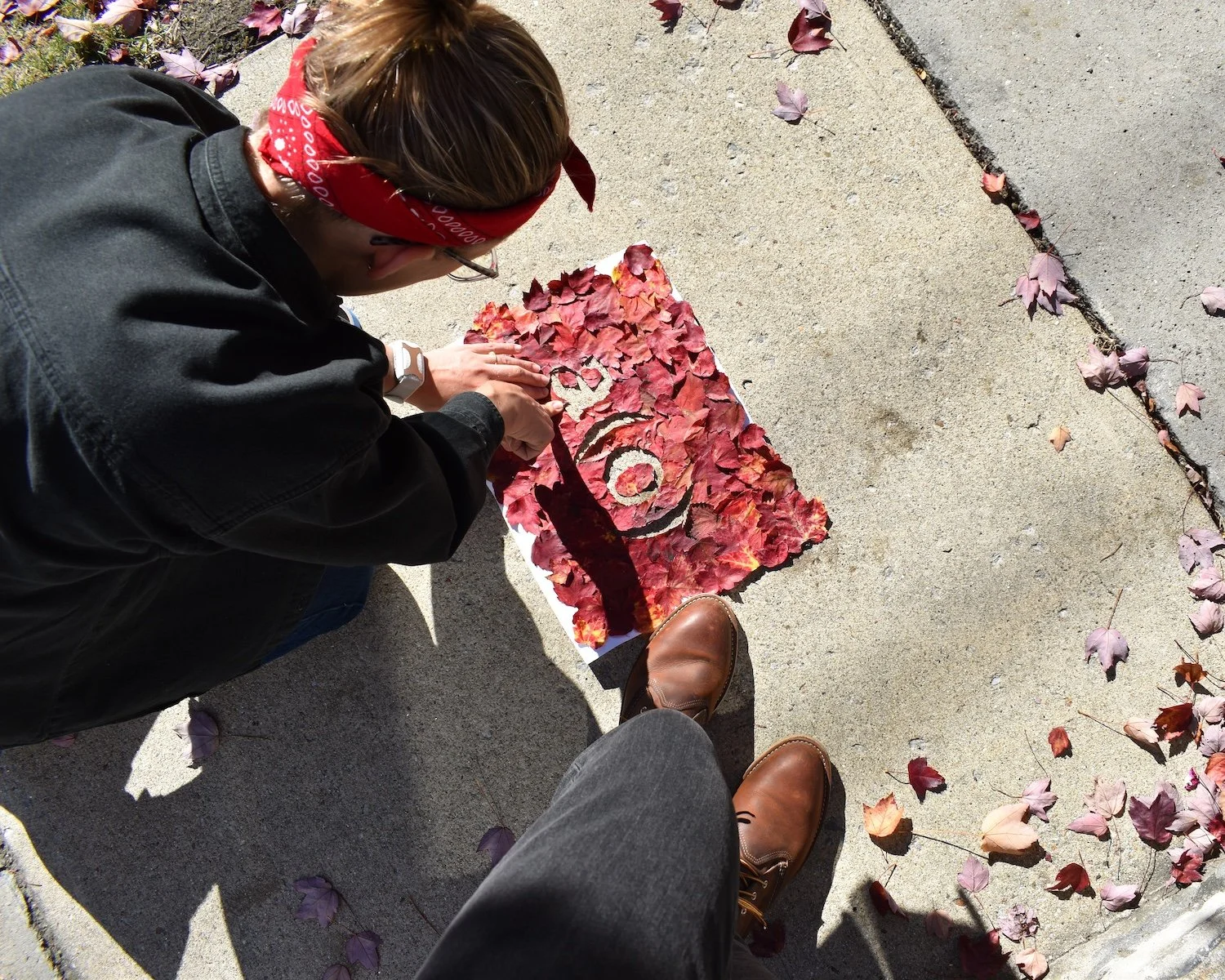 2024 – Nicole arranging an A(O) leaf collage to photograph.