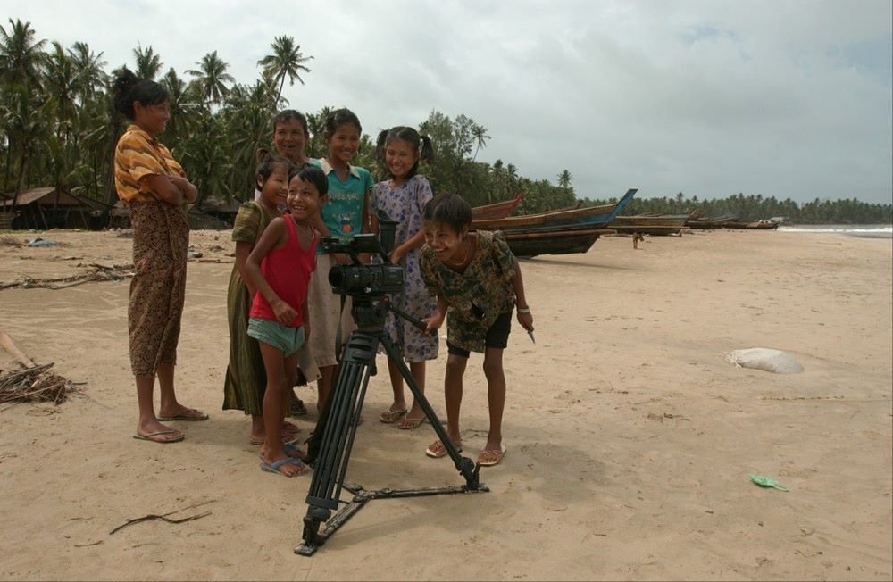 The local kids in Ngapali, Myanmar take turns in shooting the crew.