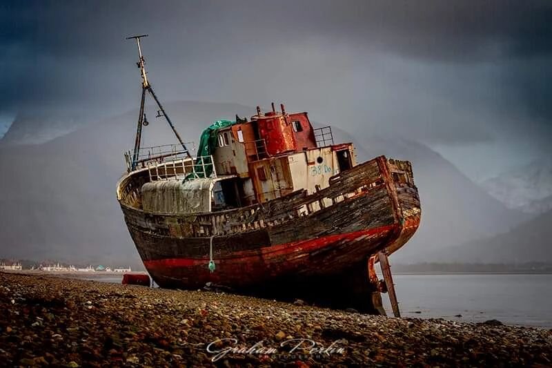An old grounded fishing boat on the shores of Corpach on the outskirts of Fort William. The MV Dayspring was a fishing vessel built in 1975 and stranded here in 2011. The mighty Ben Nevis reaching into the clouds behind..

#corpach #shipwreck #fortwi