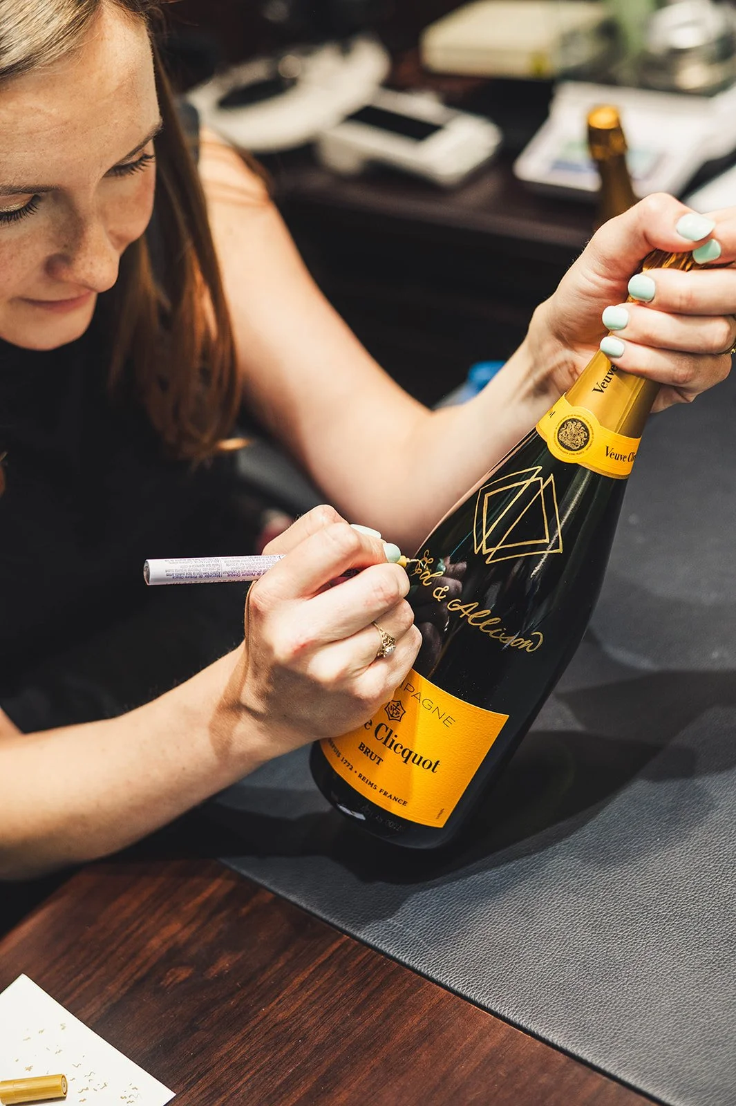on-site champagne bottle lettering