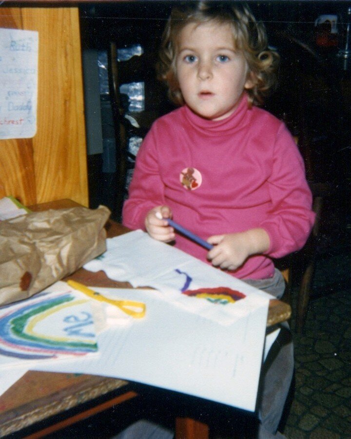Found this photo while visiting my parents.  Loving all the details. &quot;Me&quot;  written under that rainbow! The bright pink shirt, the look on my face when interrupted from my drawing.  And of course my favorite gingerbread pin. 🌈

So little ha