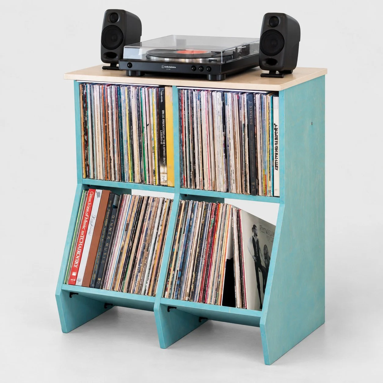 Close-up of vinyl records stored in Stax wood record cabinet