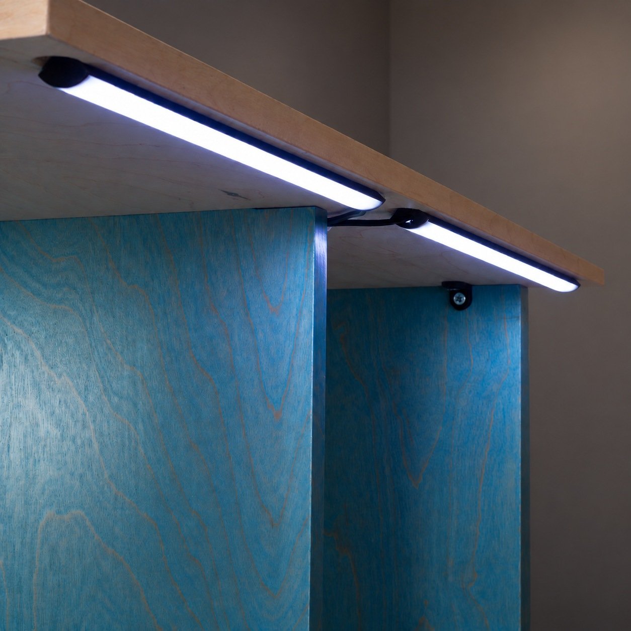 Recessed LED lighting illuminating top and bottom rows of records in Stax cabinet
