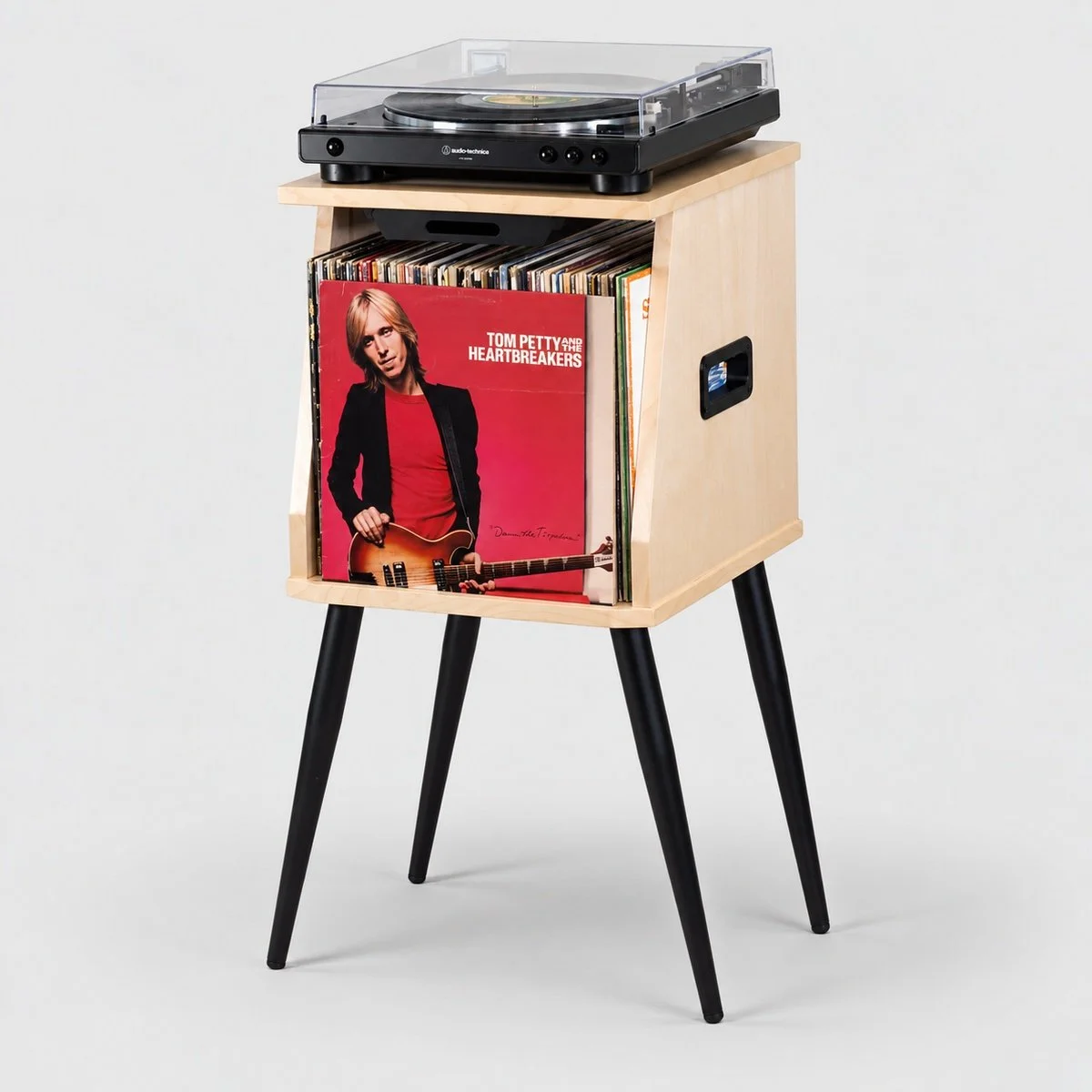 Front groove on Catalina record stand displaying the album currently playing