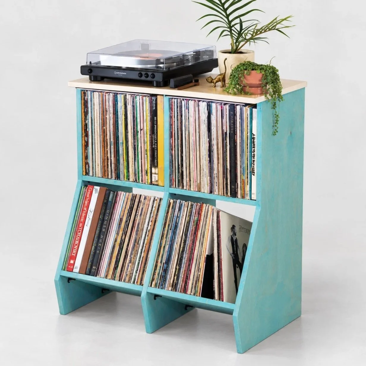 Close-up of vinyl records stored in Stax wood record cabinet