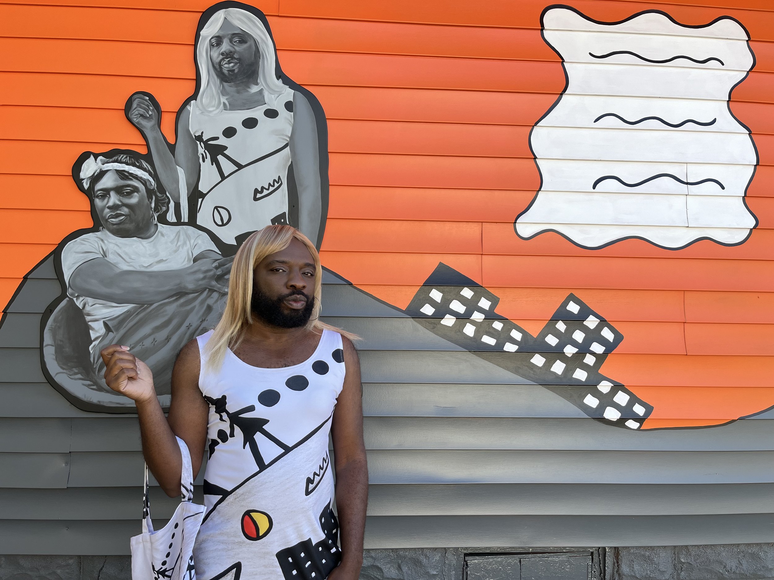 Founder Kalup Linzy poses as Katonya in front of mural. November 18, 2021. Photo: Sam
Gottsch and Queen Rose Art House.