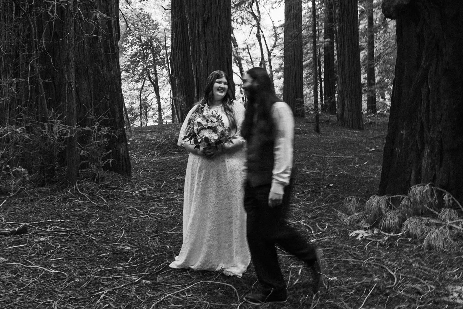 couple marry by themselves in the forest but still find the time to be playful with each other after their elopement ceremony
