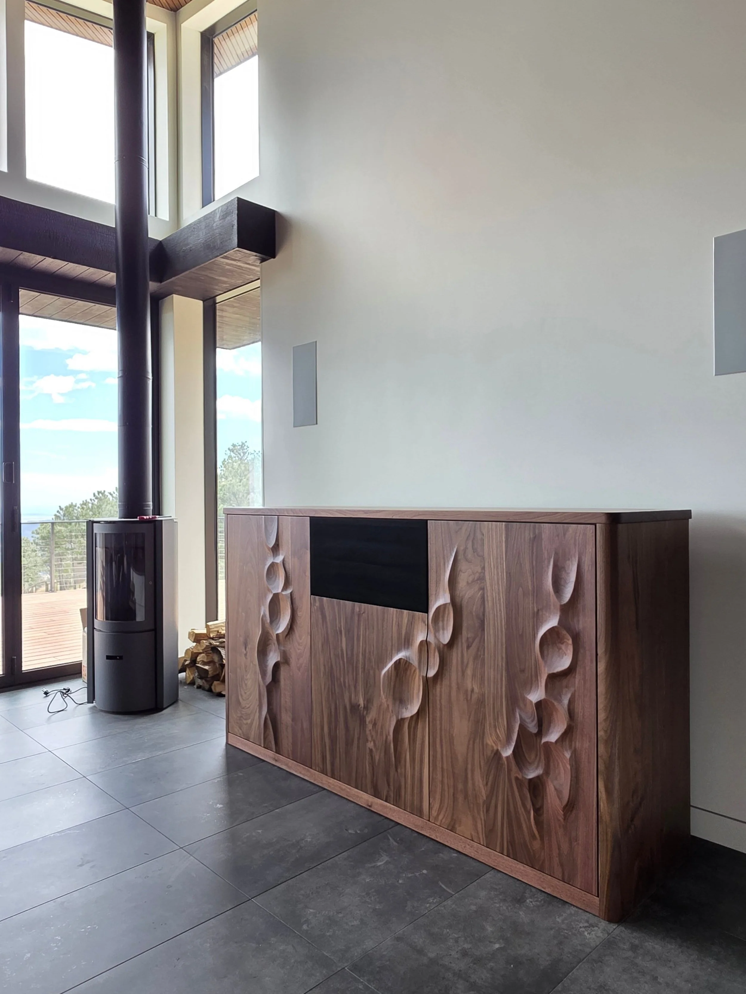 From the client: "This is the most beautiful TV cabinet I have ever seen!"

We're very fortunate to get to work on projects like this that use all of our skills and artistic sense. This TV lift is fun to look at whether the TV is out or not