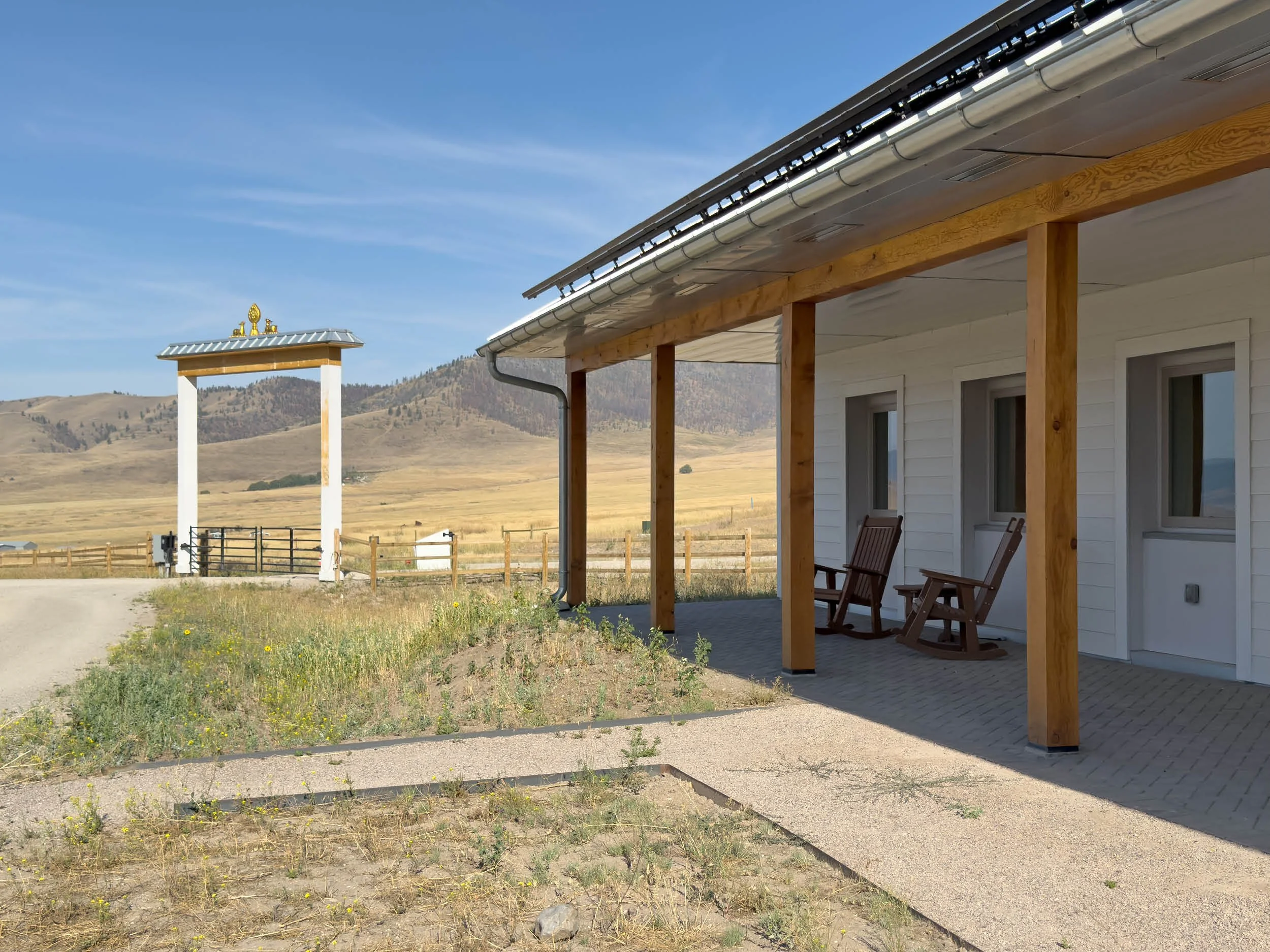 The porch of the Welcome House, a straw panel building at the Namchak Retreat Ranch in rural Montana.
