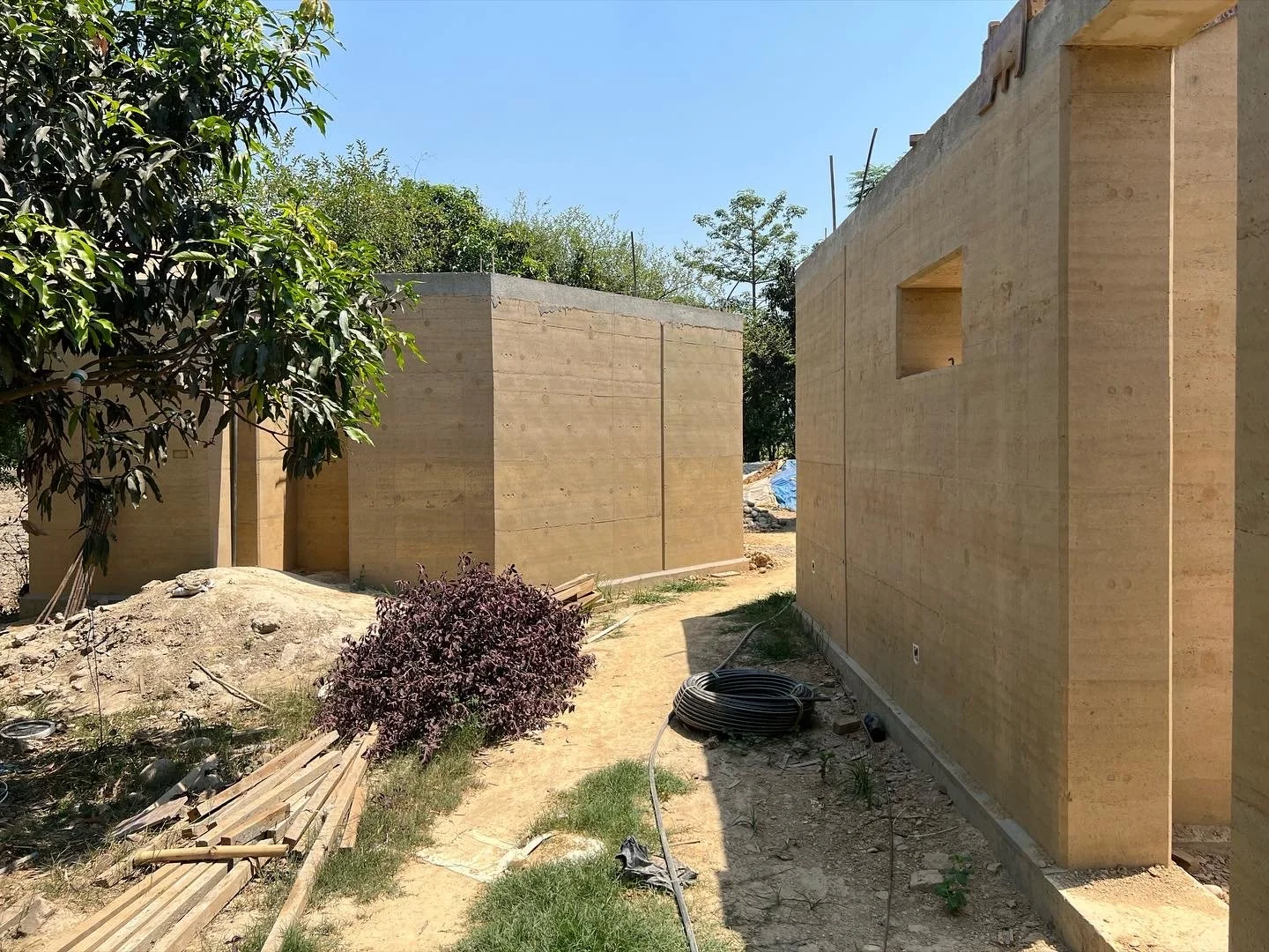 Construction of the rammed earth walls for the Tiger Track Ecolodge in Nepal.