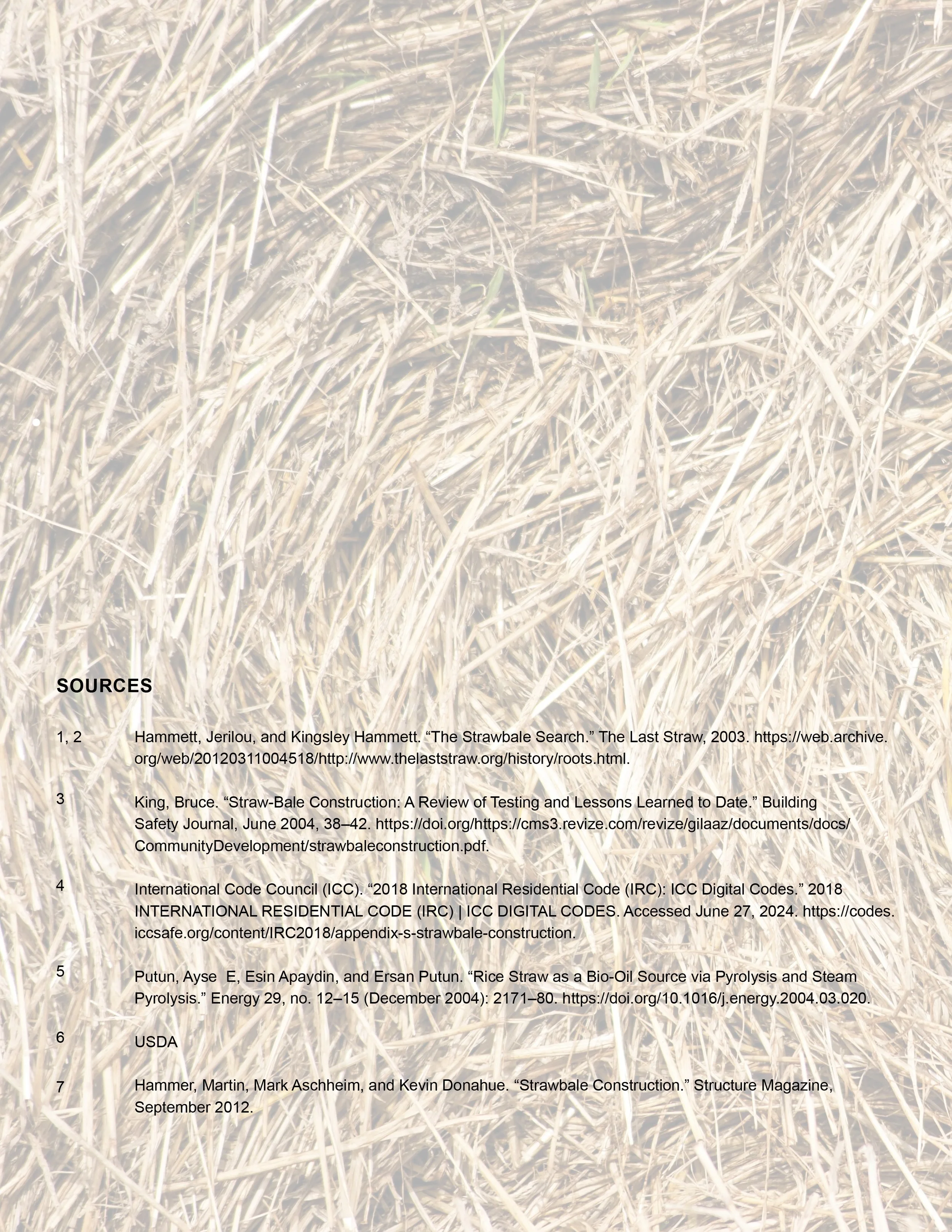 A close-up photograph showing the dry, yellowish stalks and stems of straw.