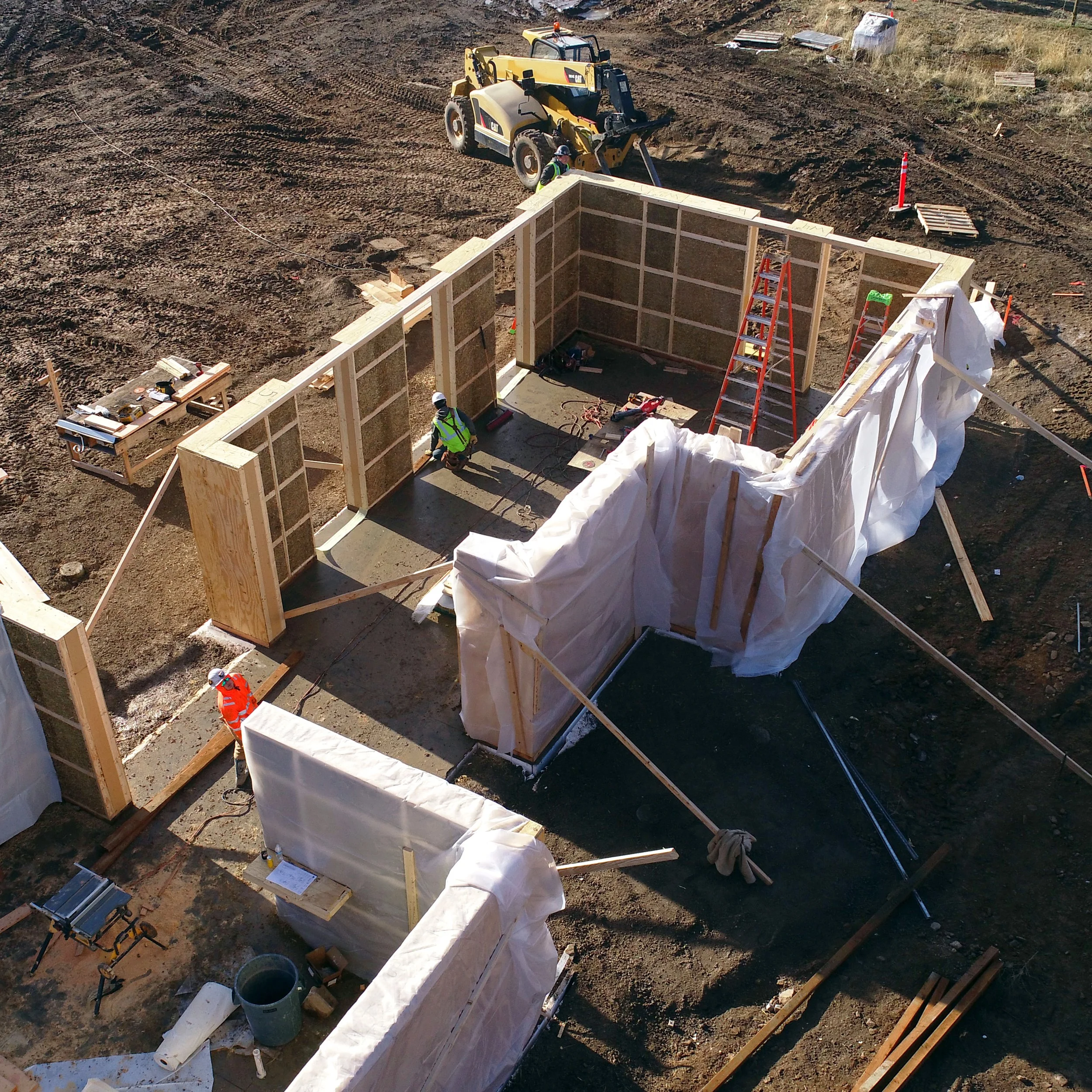 Construction of the Welcome House prefabricated straw panels on site in Montana.