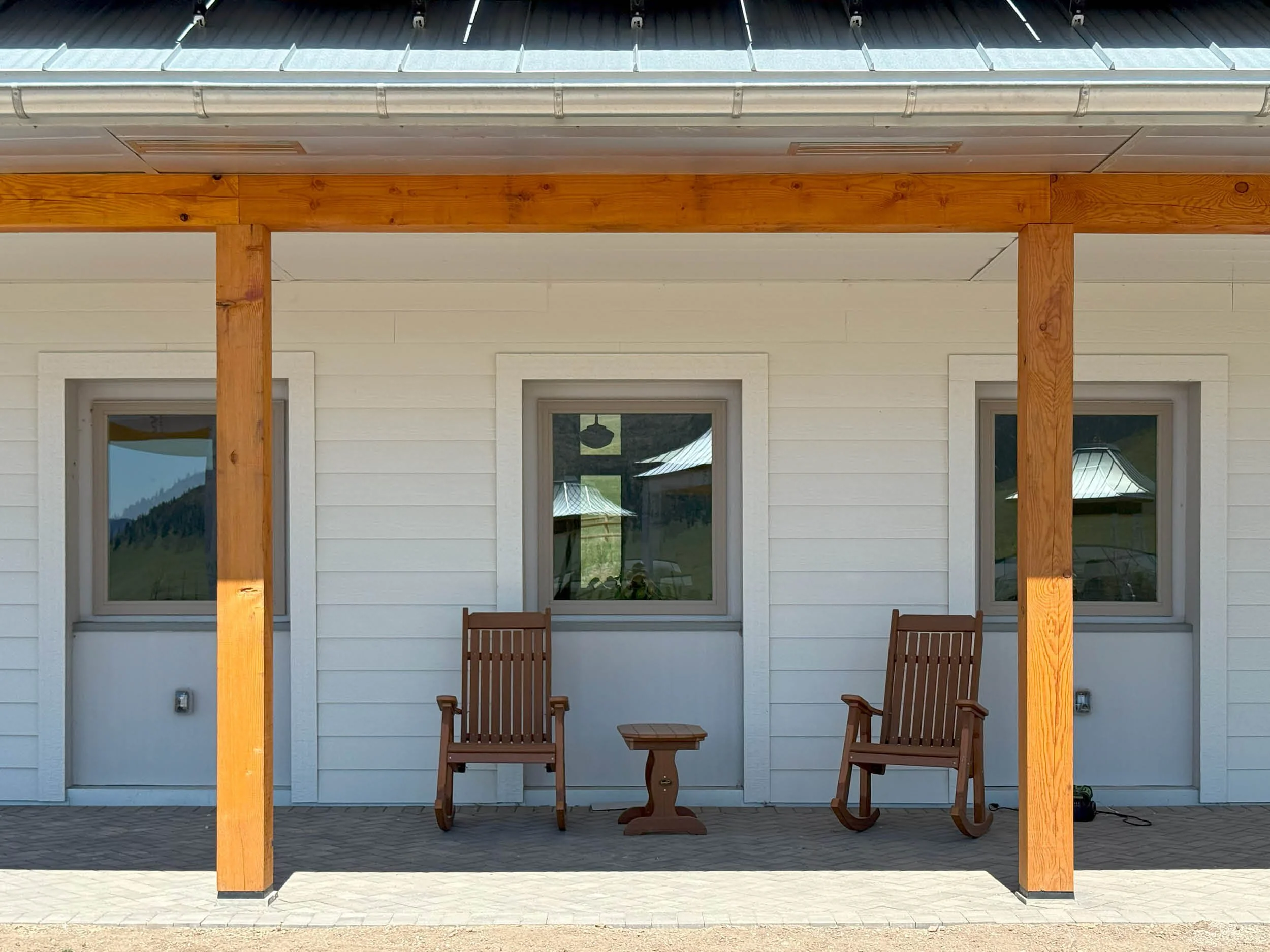 Rocking chairs on the back patio of the Welcome House at the Namchak Retreat Ranch, a Tibetan Buddhist site in western Montana.