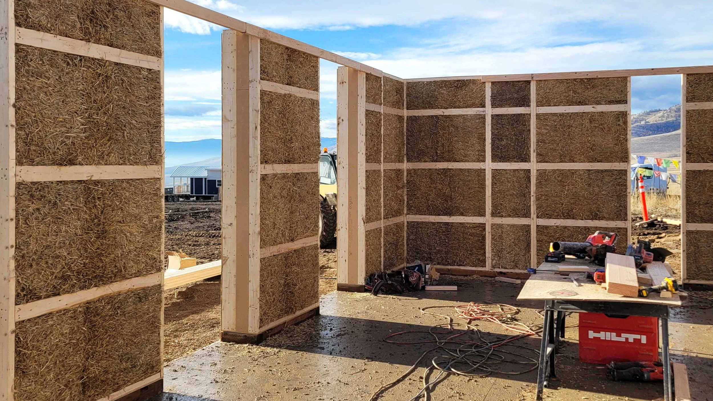 Construction of the straw-filled structurally insulated panels (SIP) for the Welcome House.