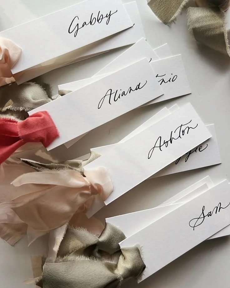 calligraphy place cards with ribbon.jpeg