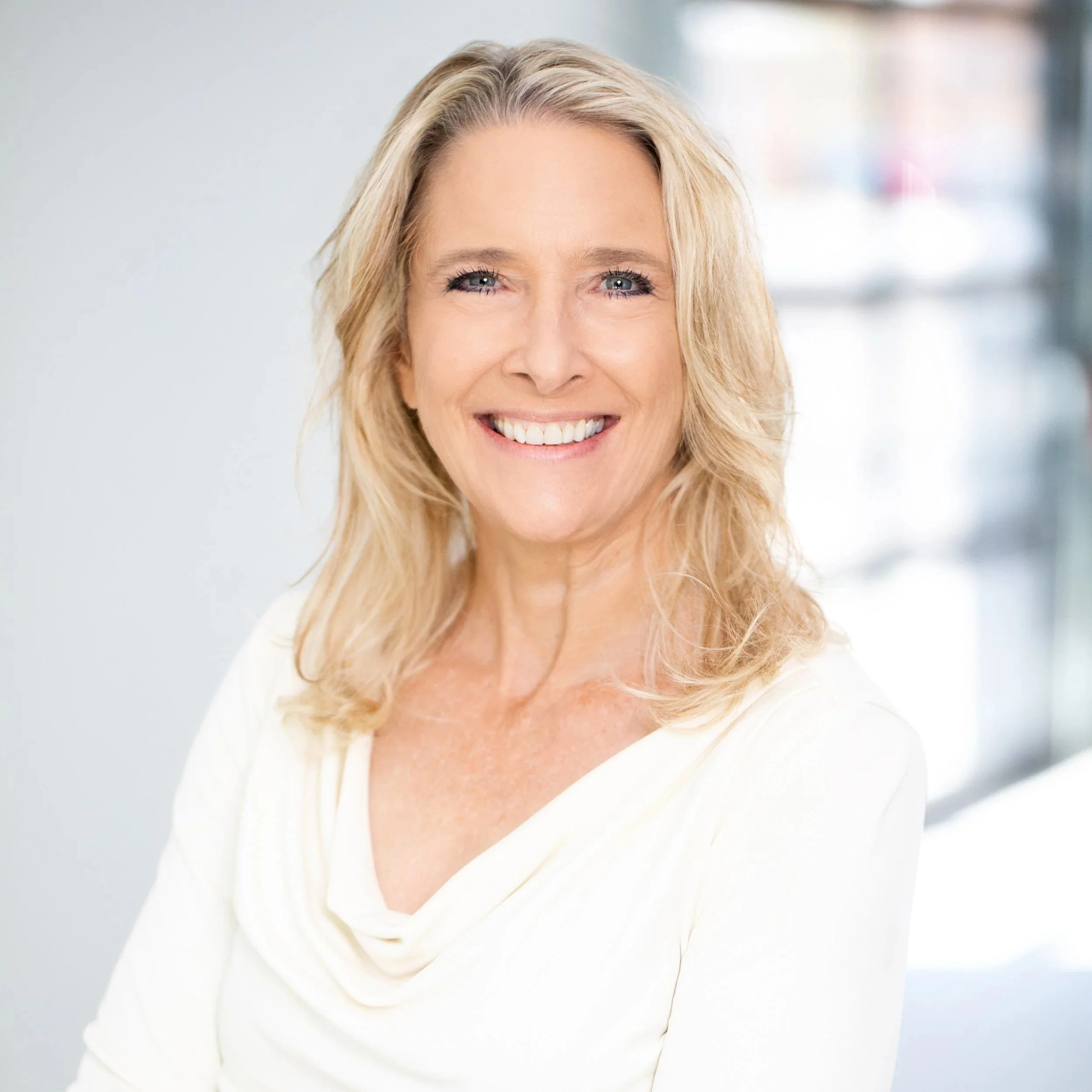 professional women in white headshot by tammy brice in minneapolis
