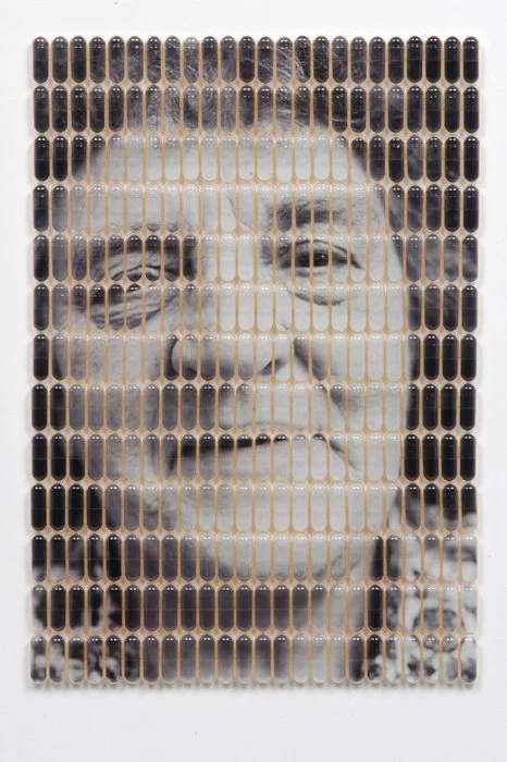 Grandma’s Pills |
Archival digital print in gelcaps |
12” h x 9” w x 0.25” d |
2006 |
“Grandma’s Pills” uses a photo I’d taken in the early ‘80’s of my grandmother. It was then cut into 312 capsule shapes and inserted into gelcaps and re-assembl