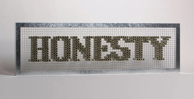 Honesty |
Dollar bills, hardware mesh, galvanized steel, Wood |
11.5” h x 39” w x 2.6” d |
2008 |
My original concept for the piece was to challenge a person’s moral fiber when presented with a temptation. I presented 316 dollar bills rolled and i