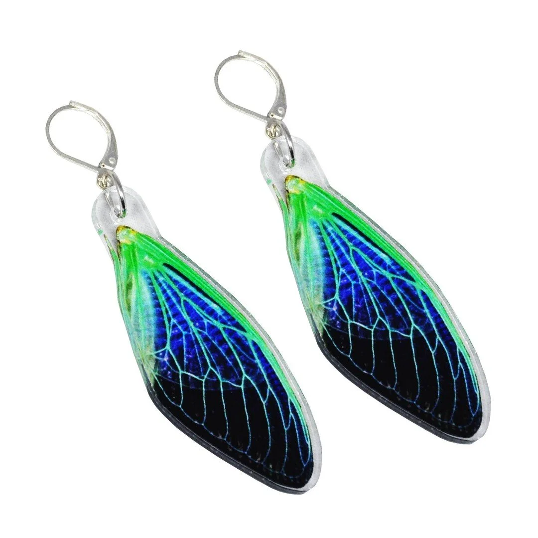 🦋🪲 Going through inventory, I have 1 last pair of Neon Cicada earrings left! Who wants 'em? Grab it before I archive this design. No bugs were hurt in the making of this product 🙂 [https://astralfae.co/shop]

#smallbatch #Astralfae #cyberpunk #kaw