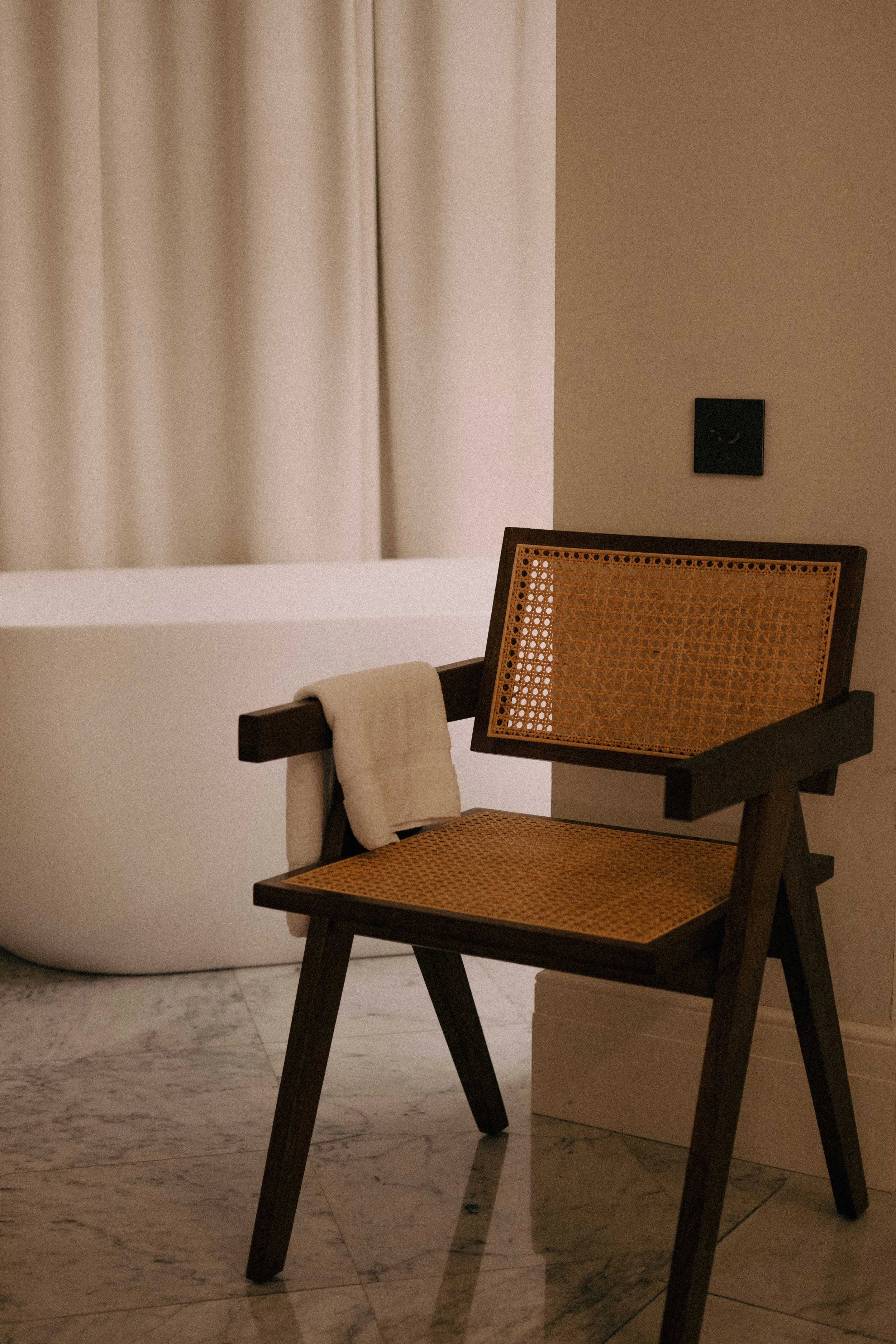 luxurious bathroom with wooden chair