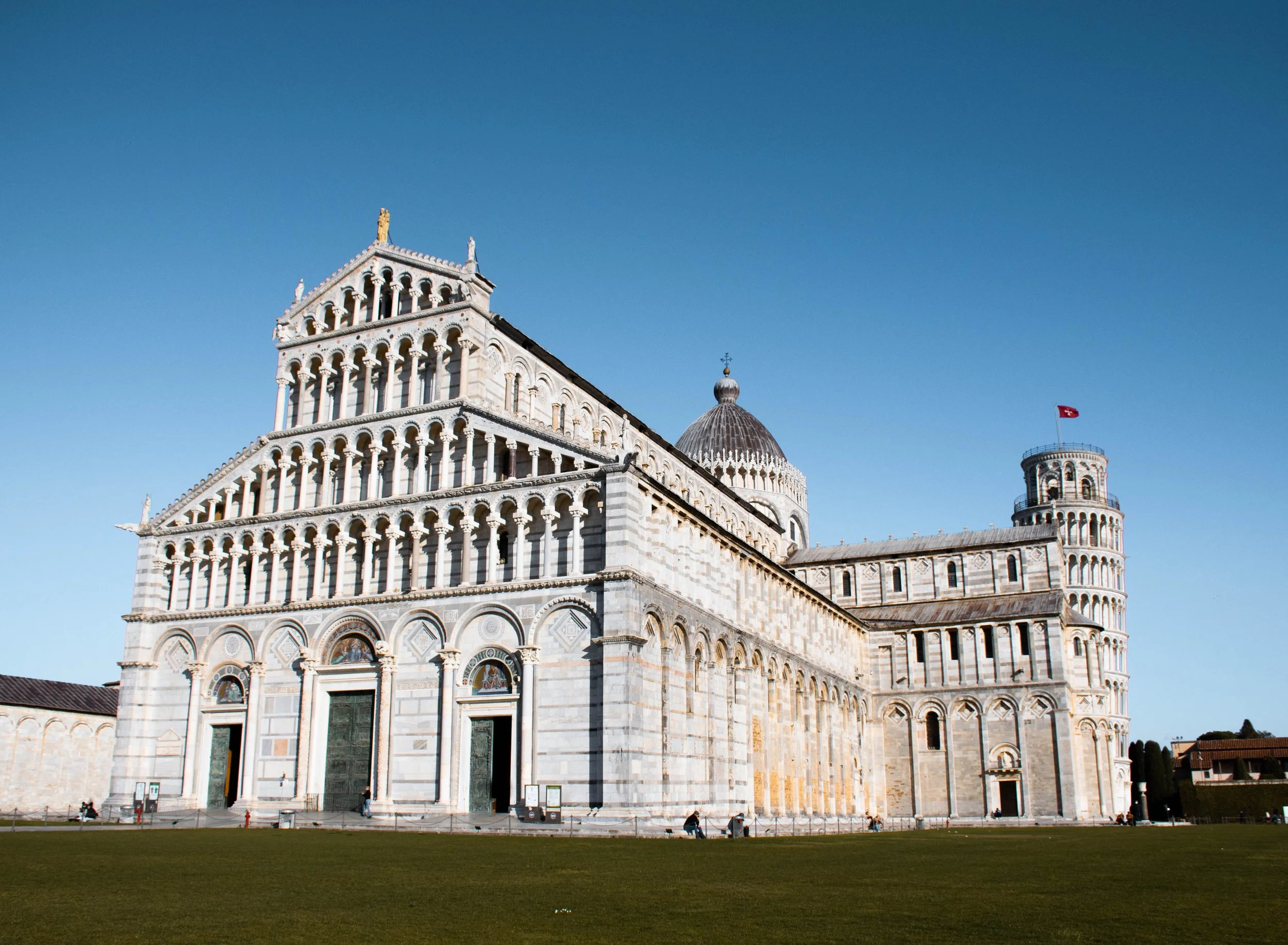 Pisa cathedral front view with the leaning tower in the background