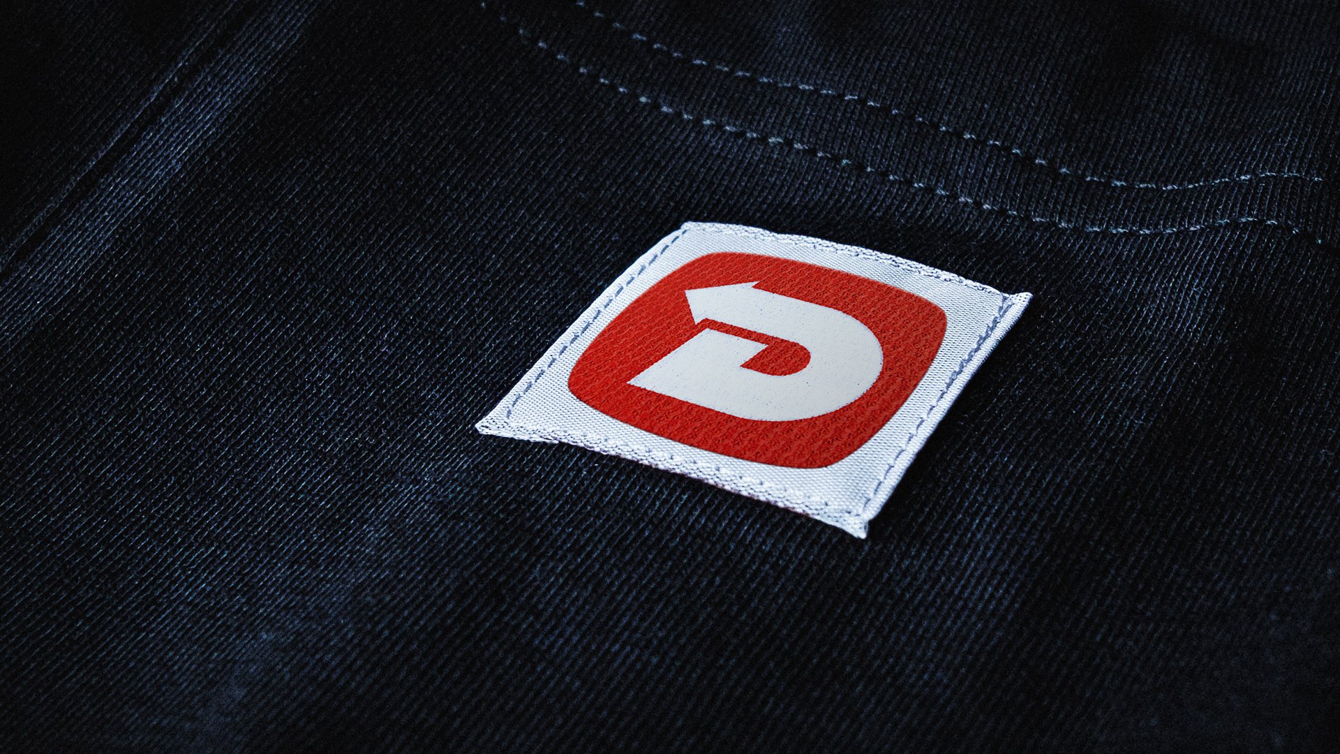 A clothing label example for the DES logo