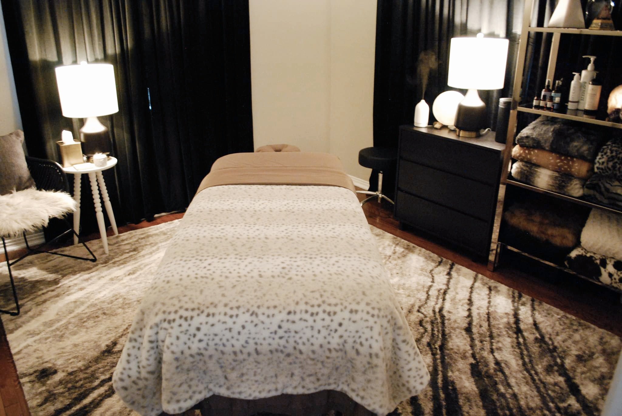 peaceful cozy massage room with soft lamps