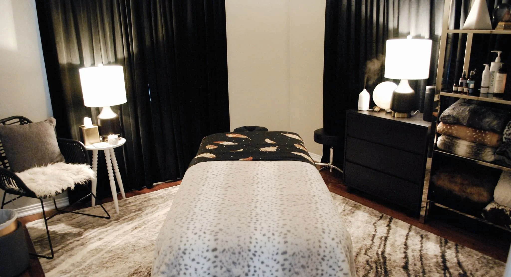 cozy massage studio room with soft lamps and aromatherapy