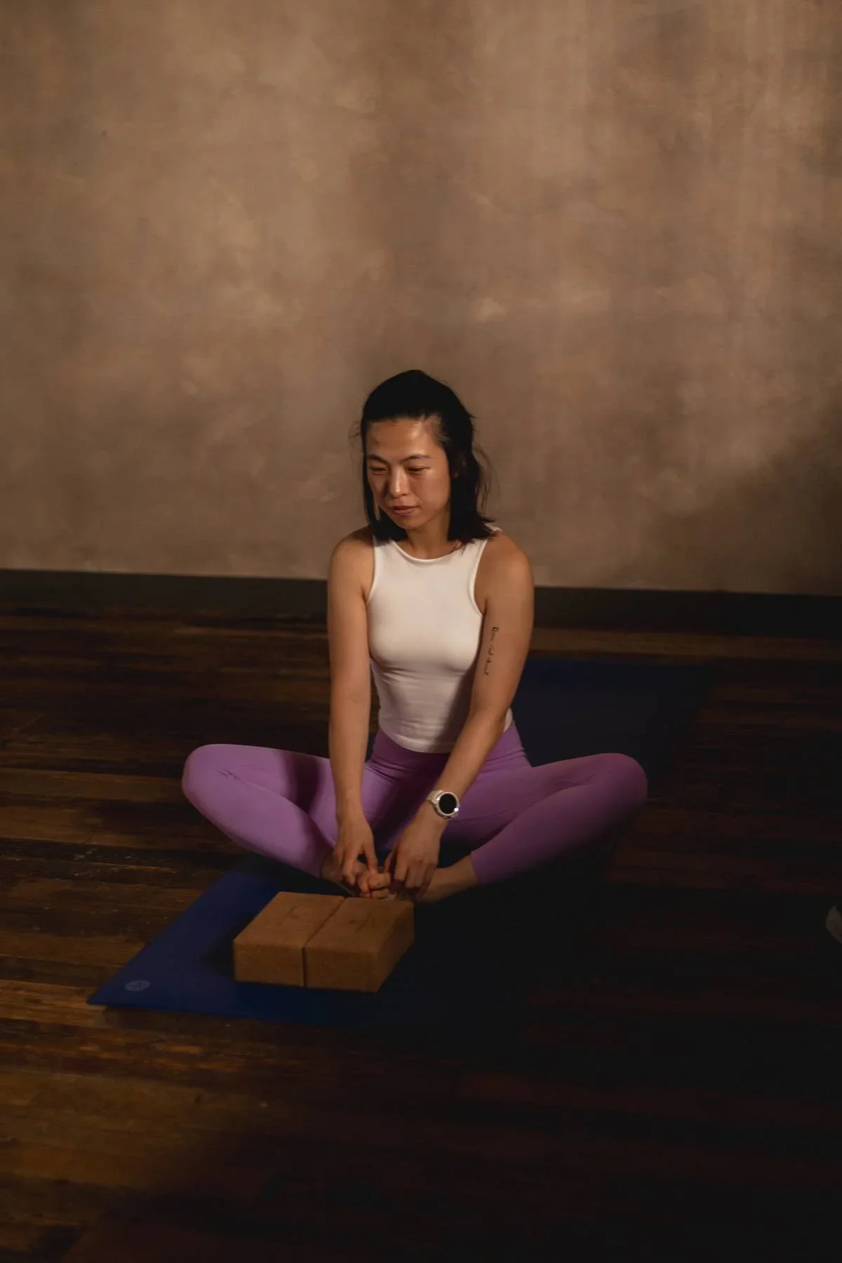 Supported seated yin yoga posture using blocks at Heist House Studios in Warwick