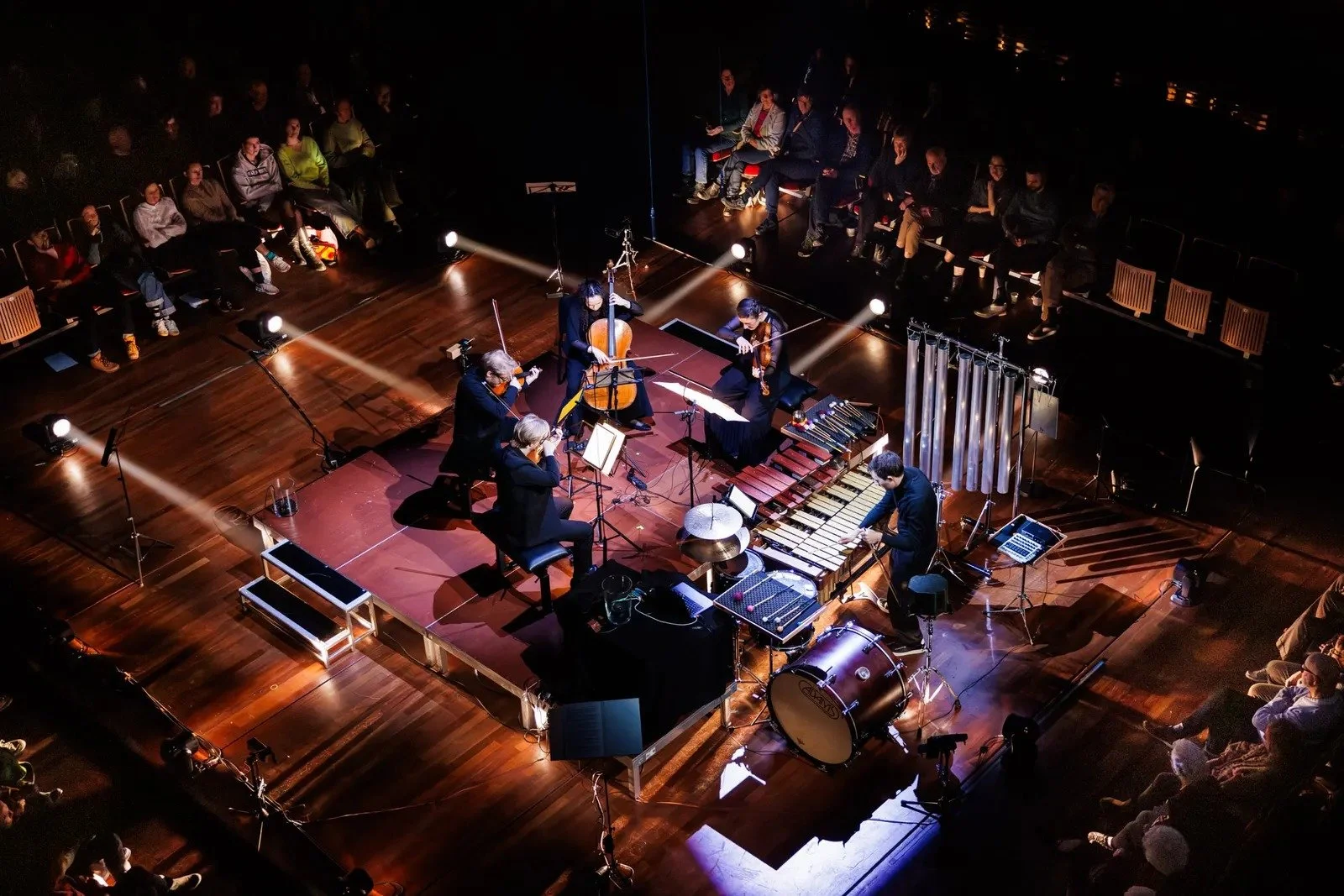 Overhead view of the stage with percussion and string quartet