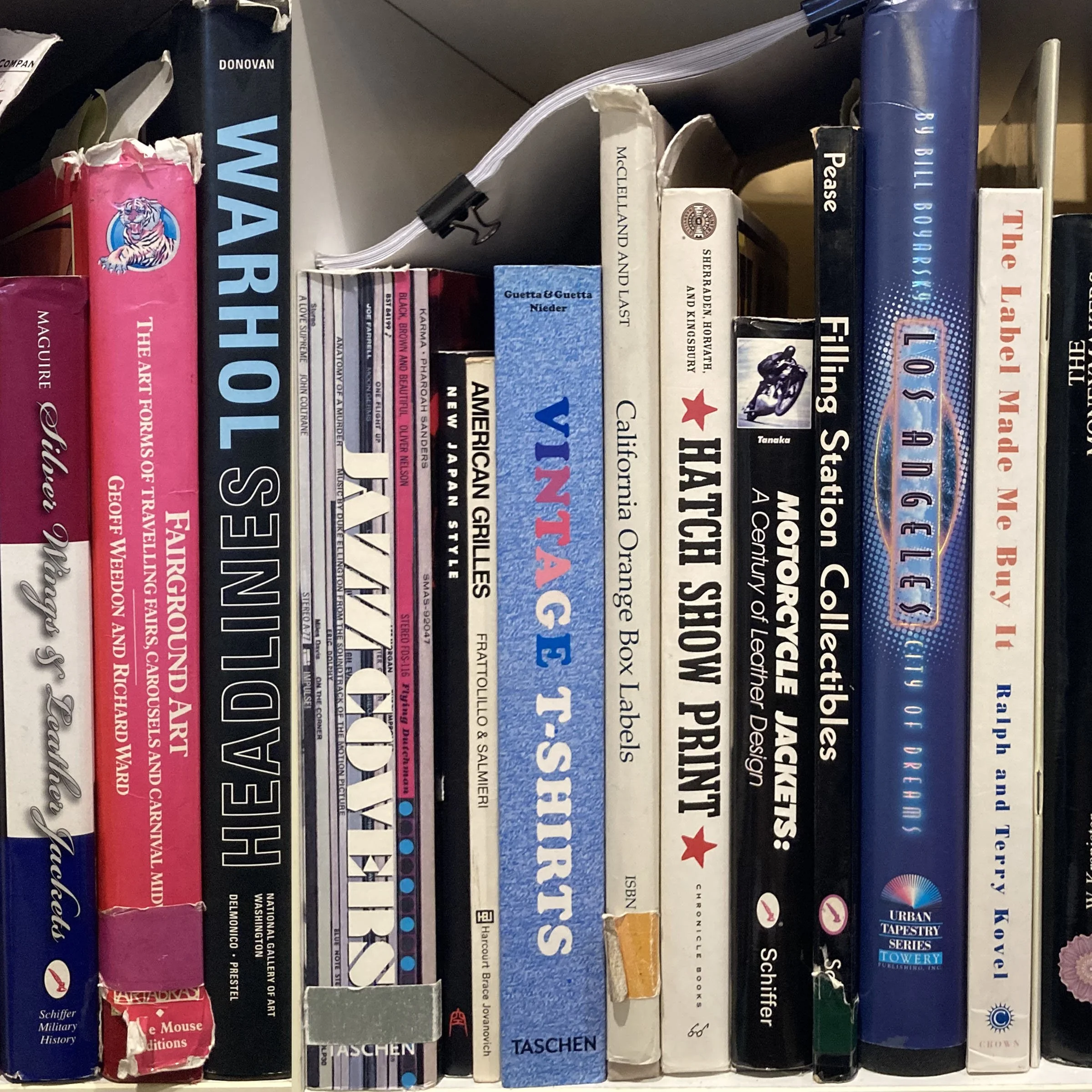 A collection of books on a shelf, including titles about history, art, and politics.