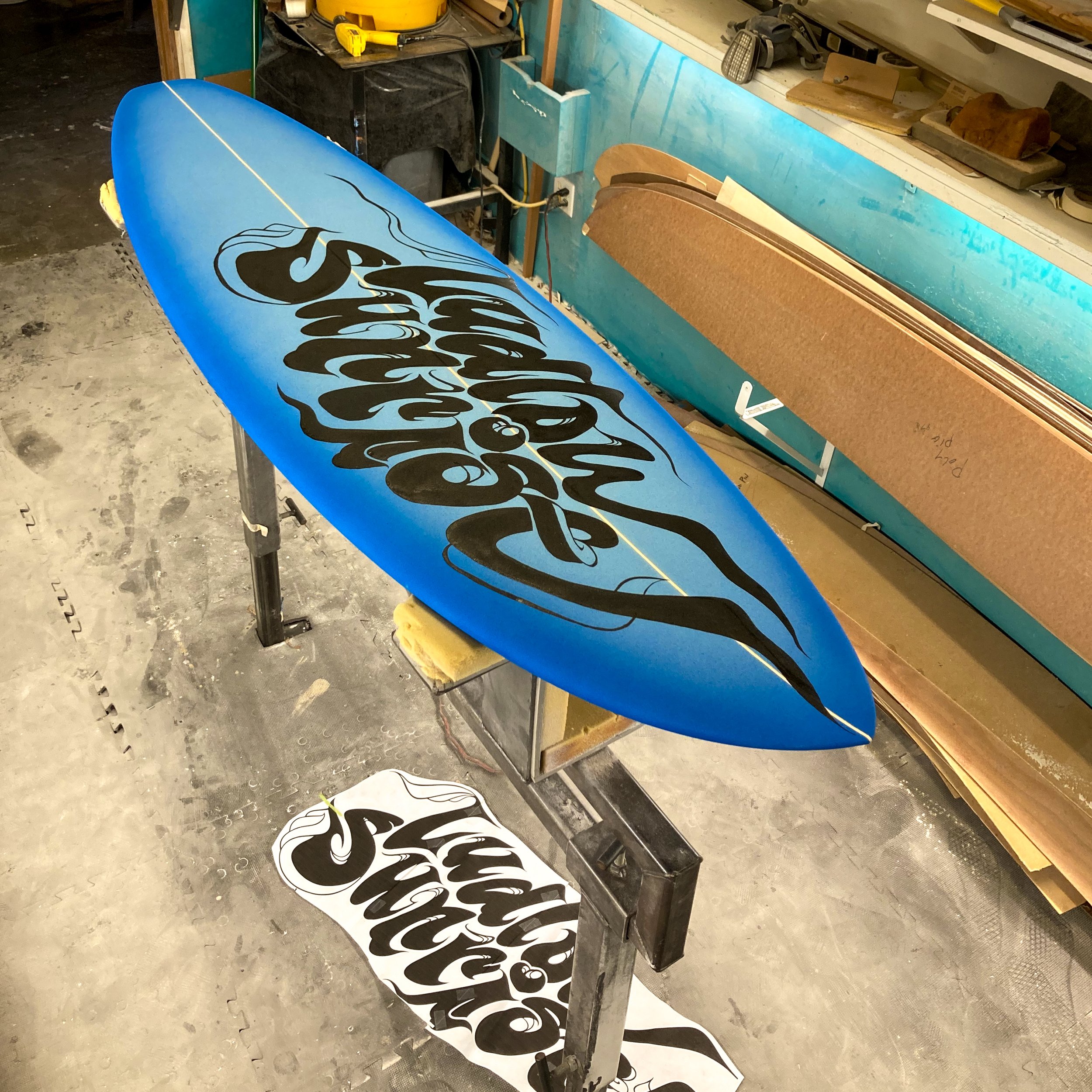 Board #1001. Hand-painted Ludlow Sunrise logo on shortboard