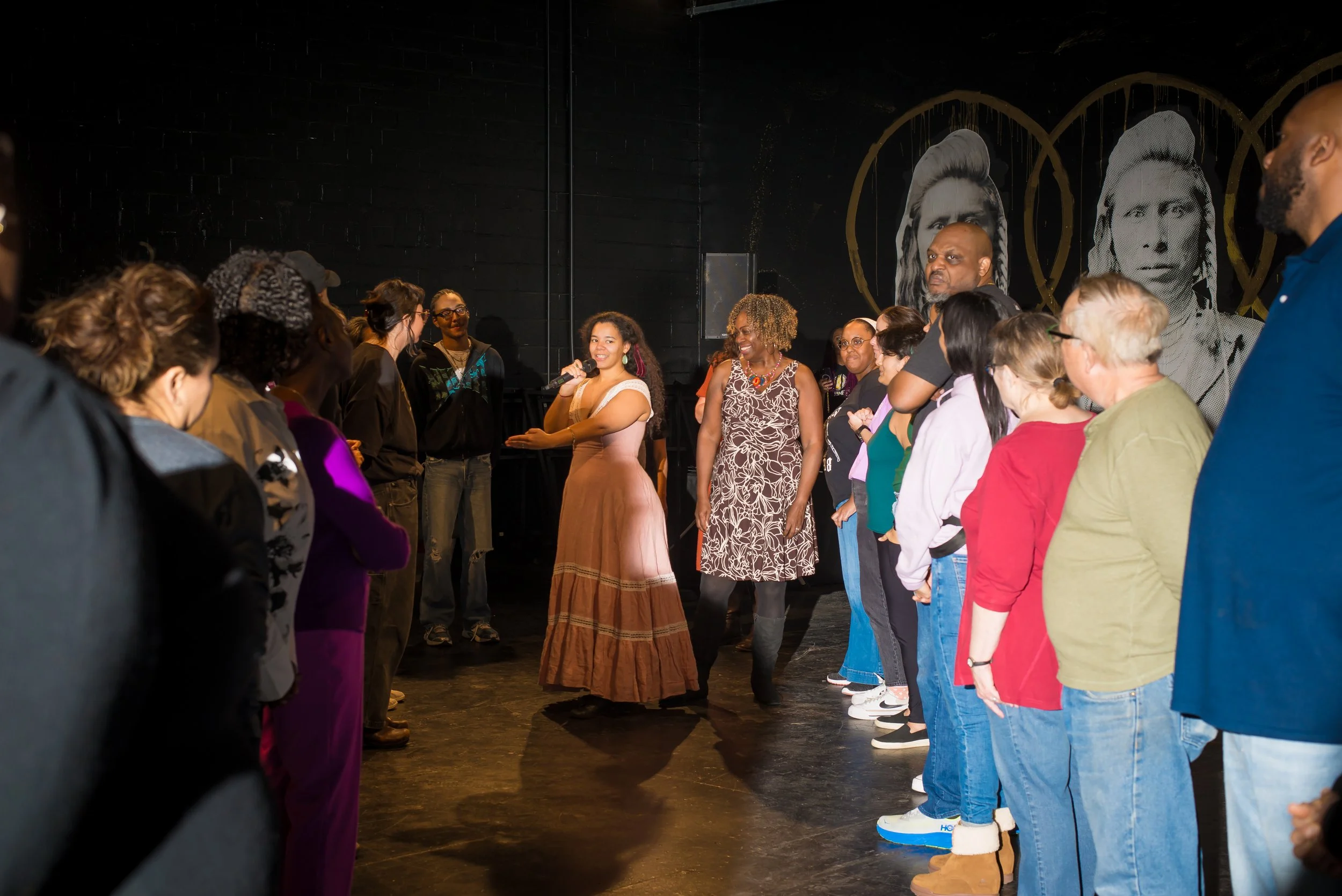 AA Dance Caller Pathways cohort member Briar teaches a dance as instructor Dr. Clover Johnson looks on.