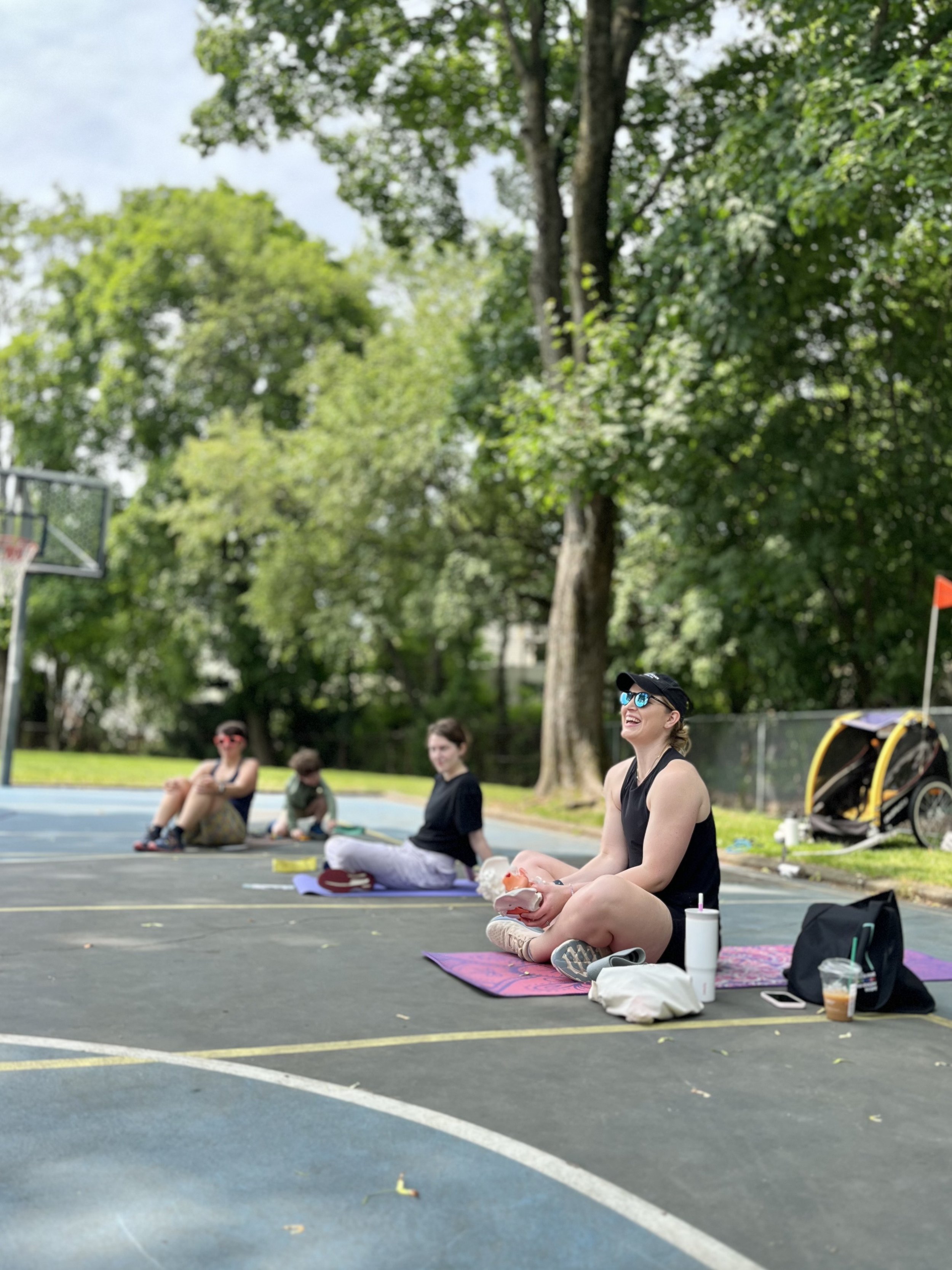 Boston-based Doctor of physical therapy Dr. Rachel Cortright leading a class of postpartum moms teaching them about pelvic floor recovery and postpartum health