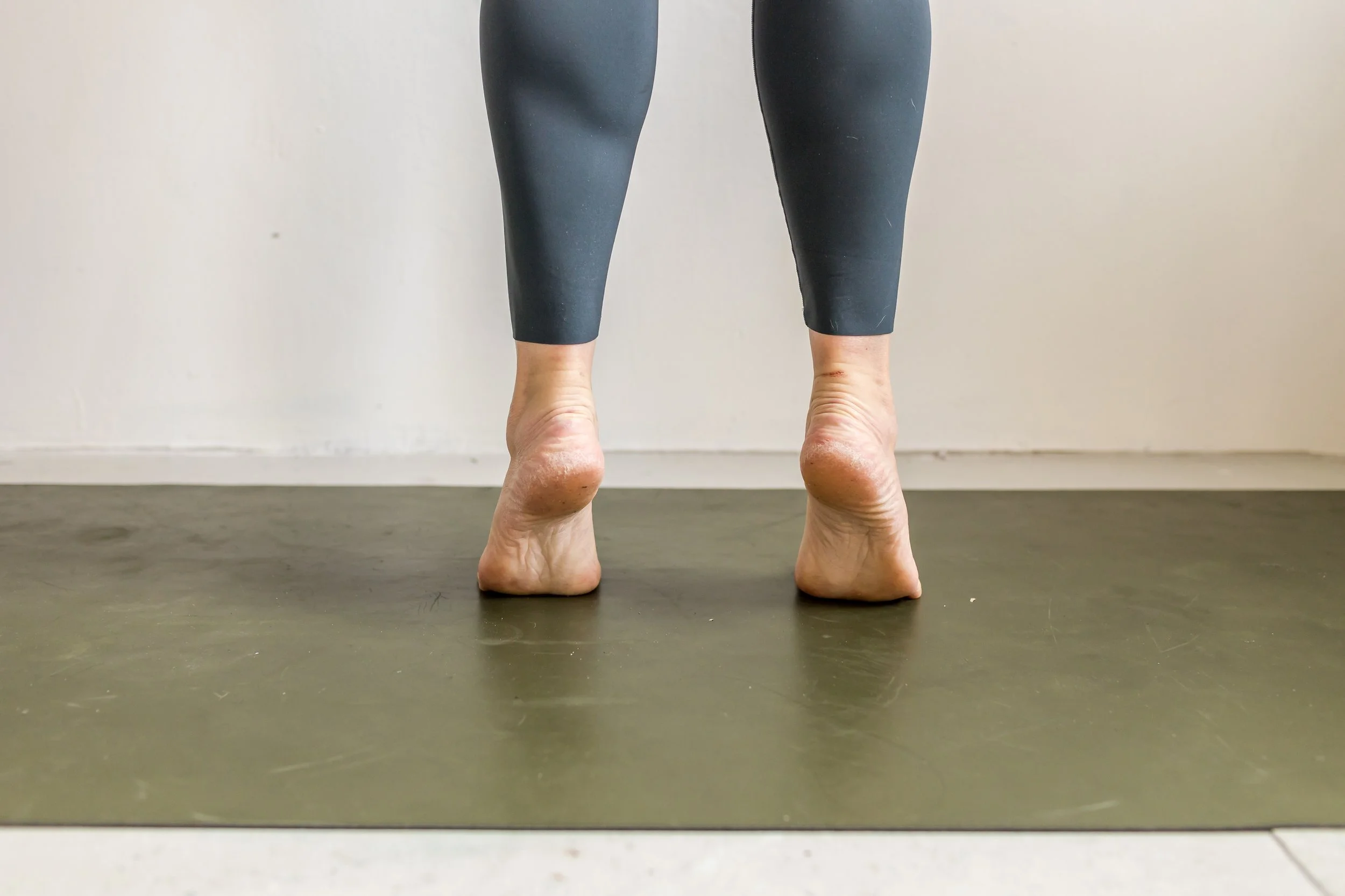 A pregnant woman doing foot exercises with a physical therapist to address her foot pain during pregnancy in Boston.