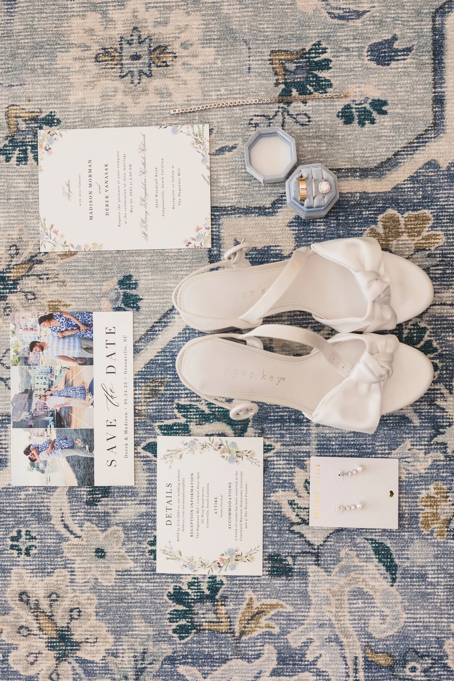 Madison and Derek's invitation suite with wedding shoes and rings.